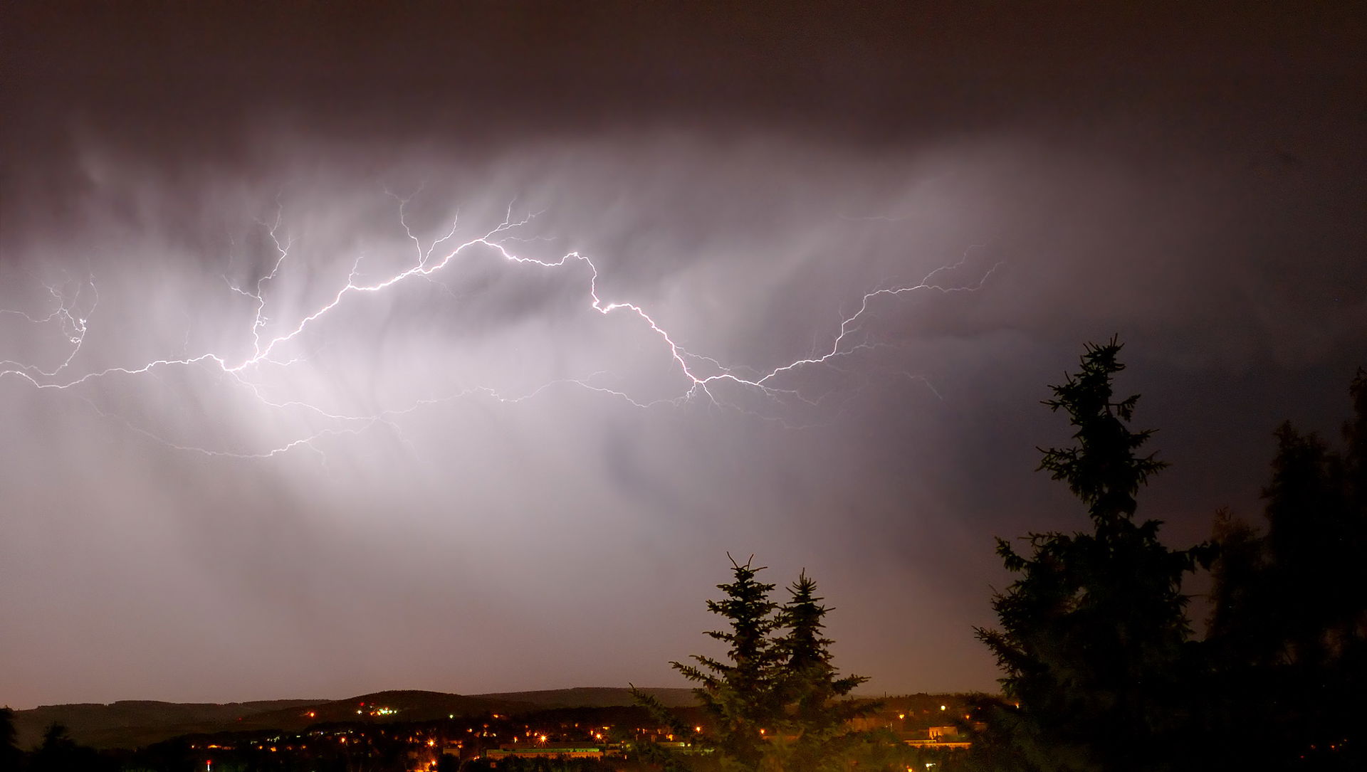 This image shows a cloud to cloud lightning in a very stormy an…