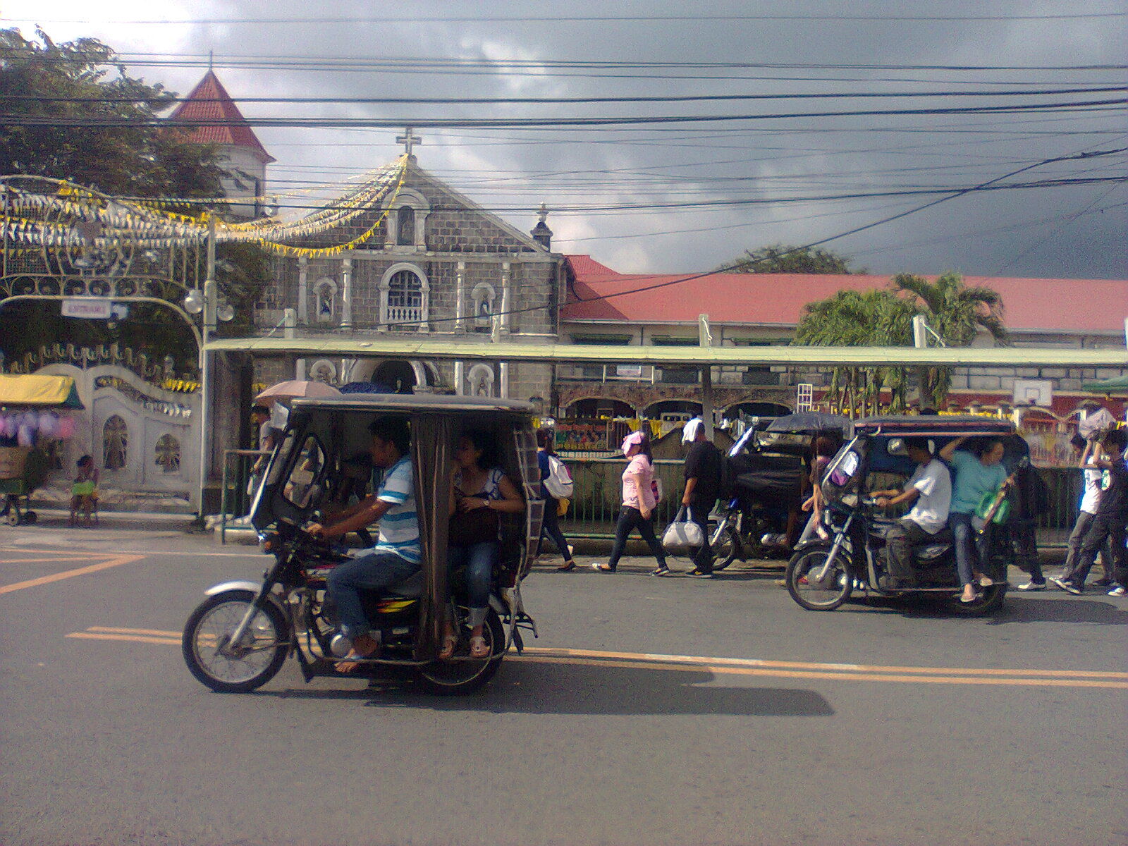 Street scene in Indang town proper, with the Church of St. Greg…