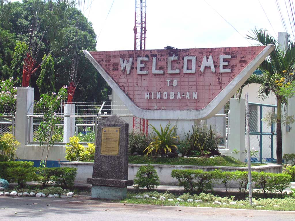 "Welcome to Hinoba-an" sign in the town proper of Hinoba-an, Ne…