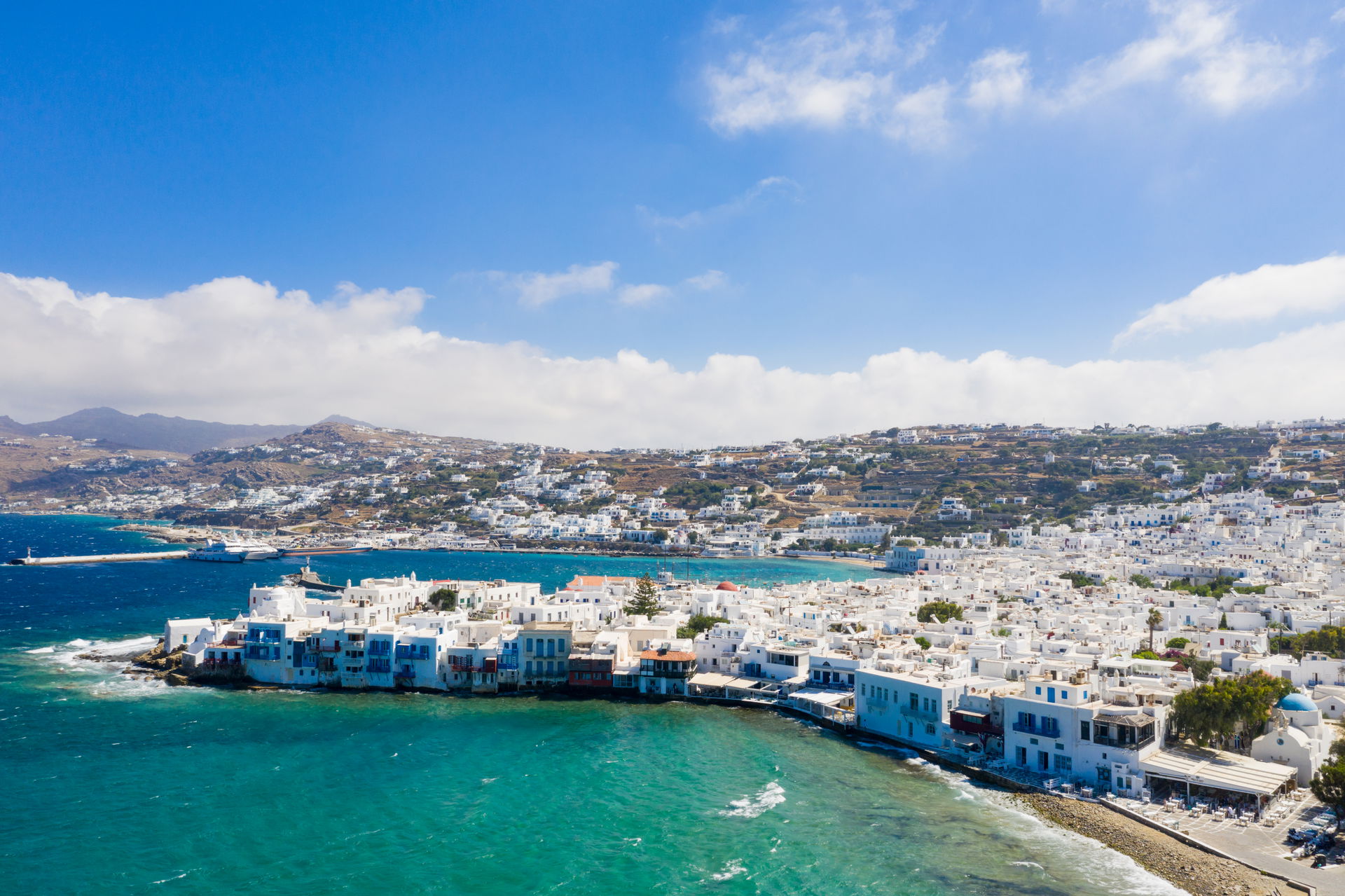 Little Venice with a view of the ferry terminal in Mykonos, Gre…