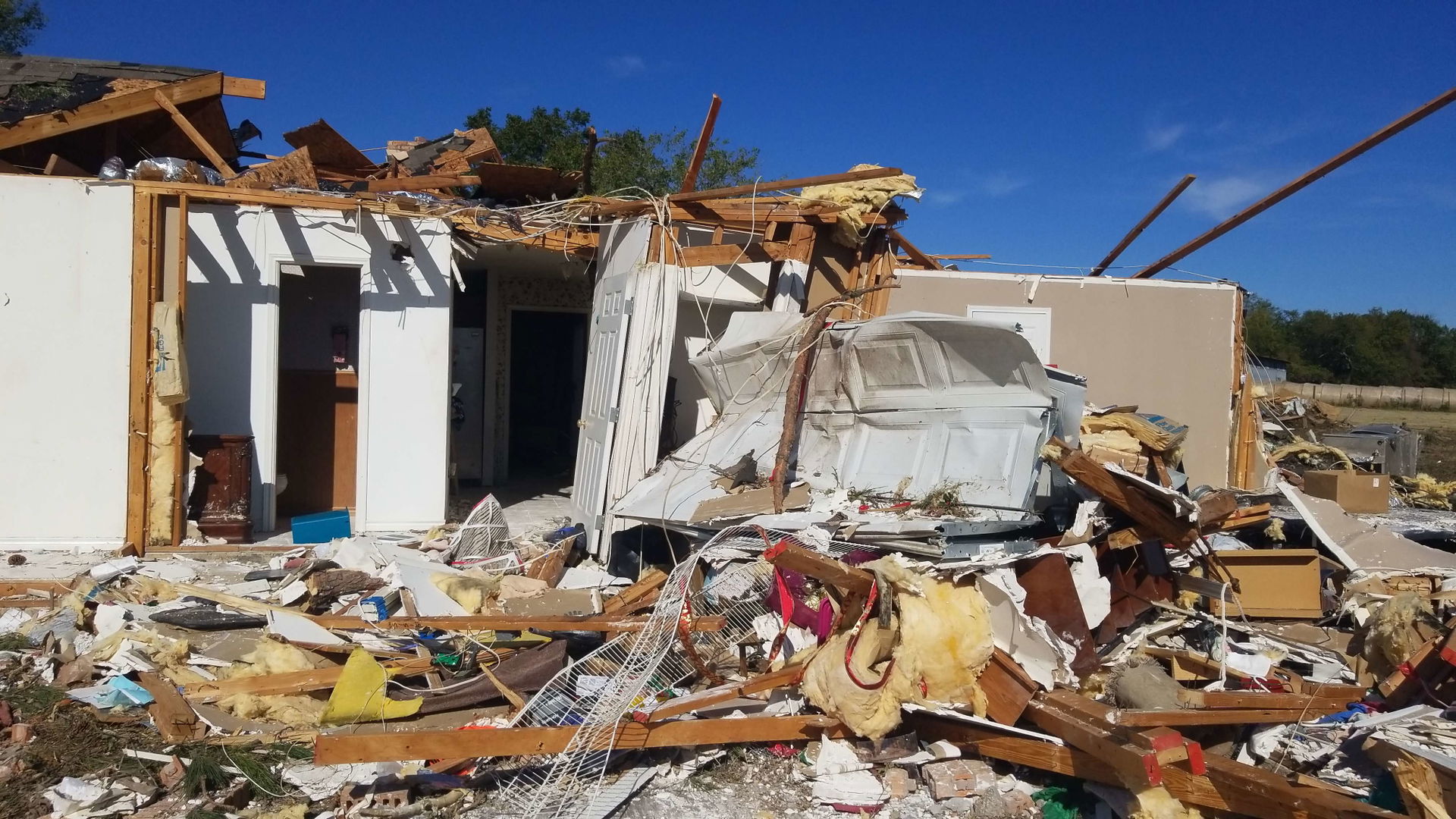 A home that was heavily damaged by an EF2 tornado southwest of …