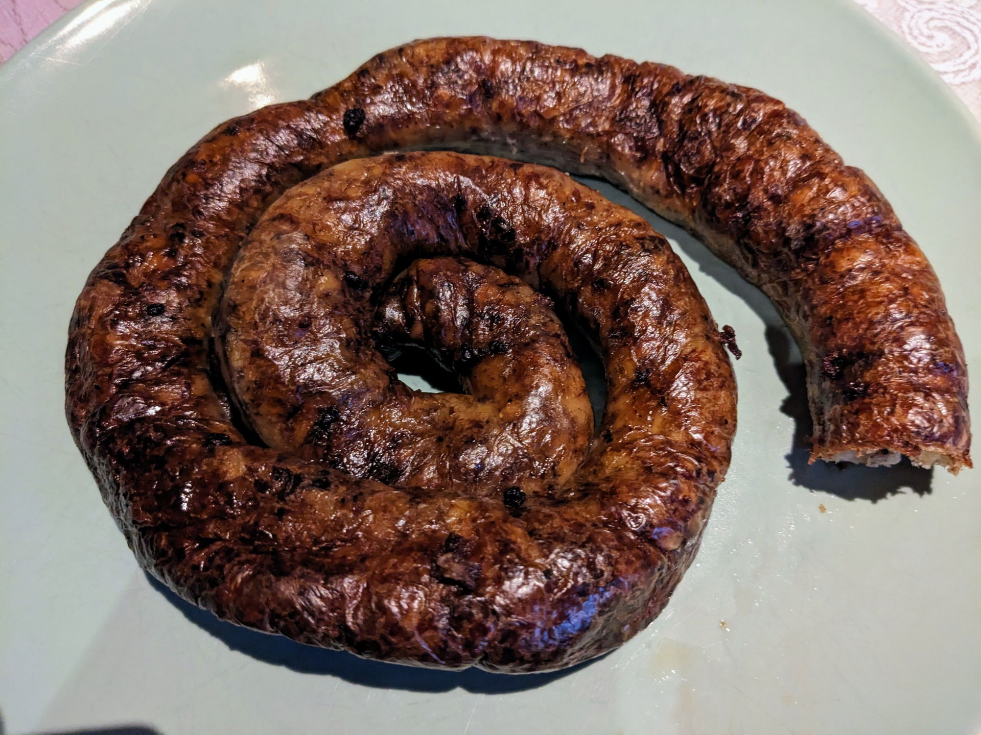 Grilled perunamakkara (potato sausage), a traditional delicacy …