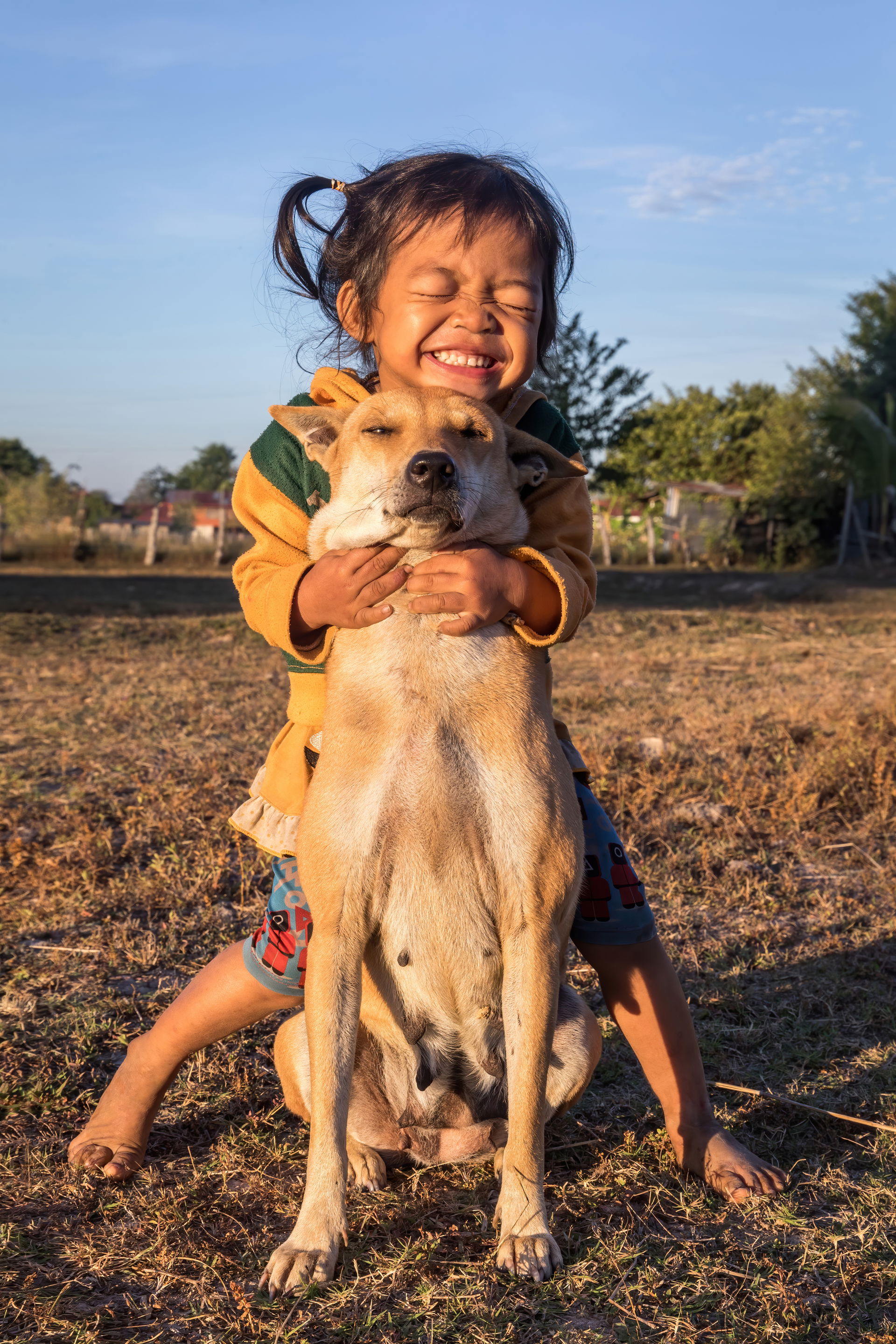 Human–canine bond (interspecies friendship). Smiling two-year o…