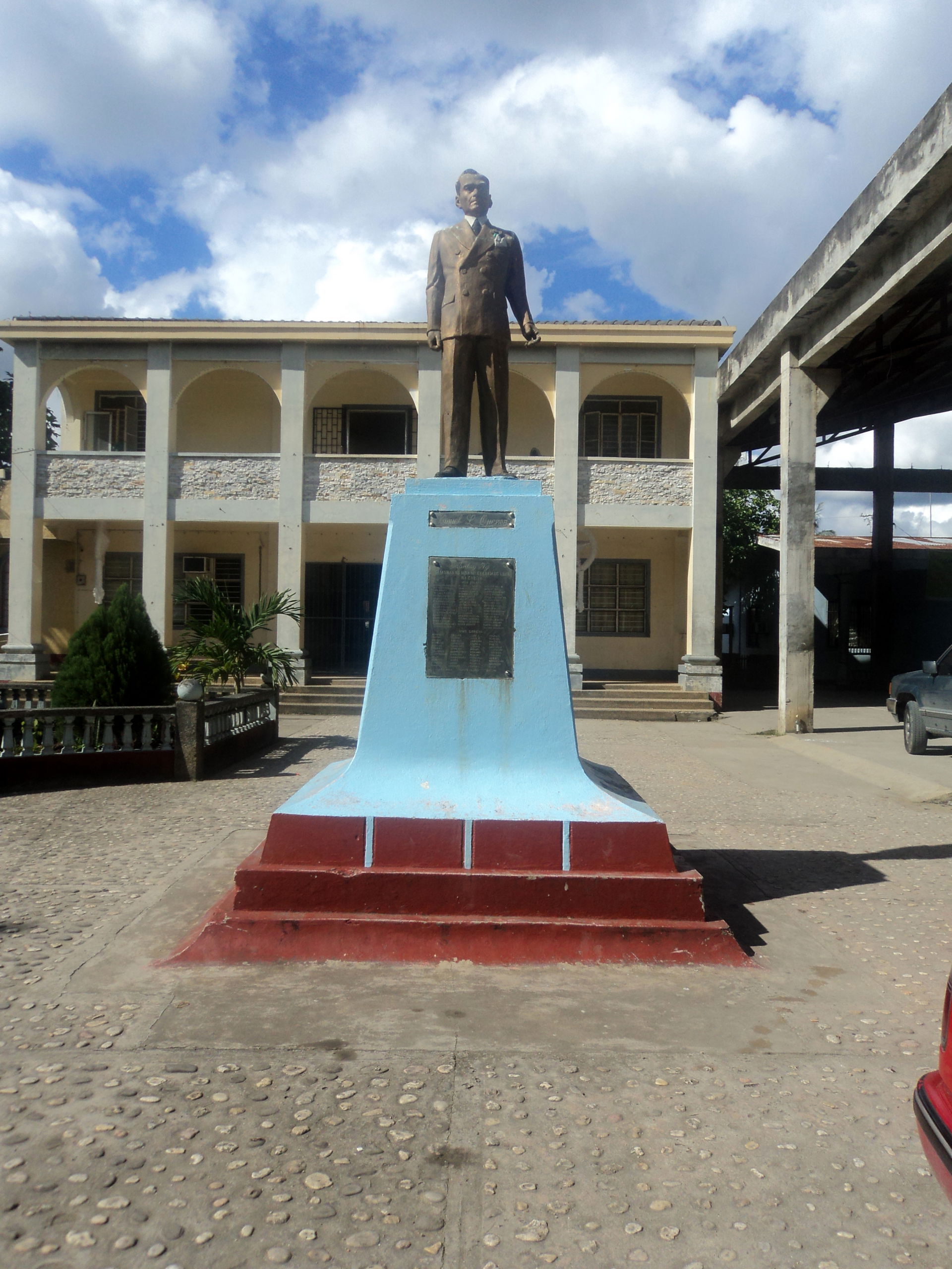 Manuel L. Quezon monument in front of the town hall of Mulanay,…