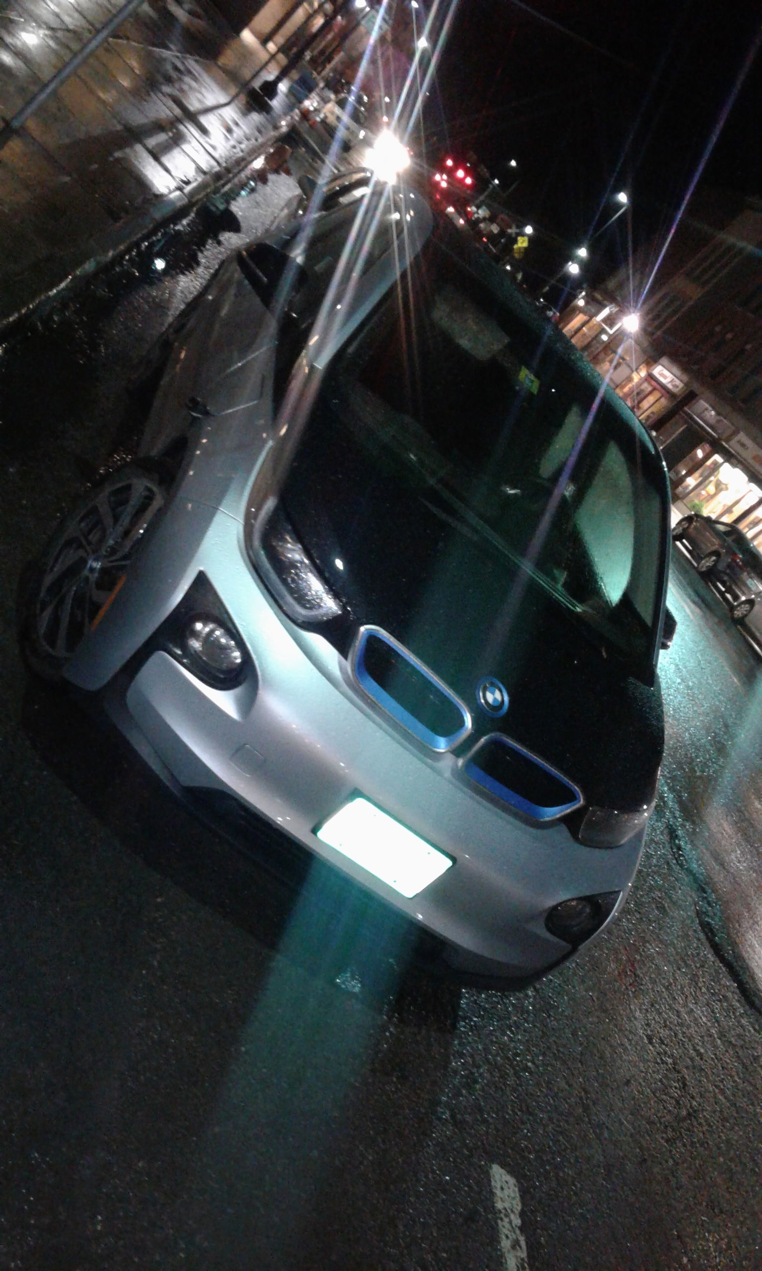 BMW i3 electric-powered vehicle parked in metered spot on Main …