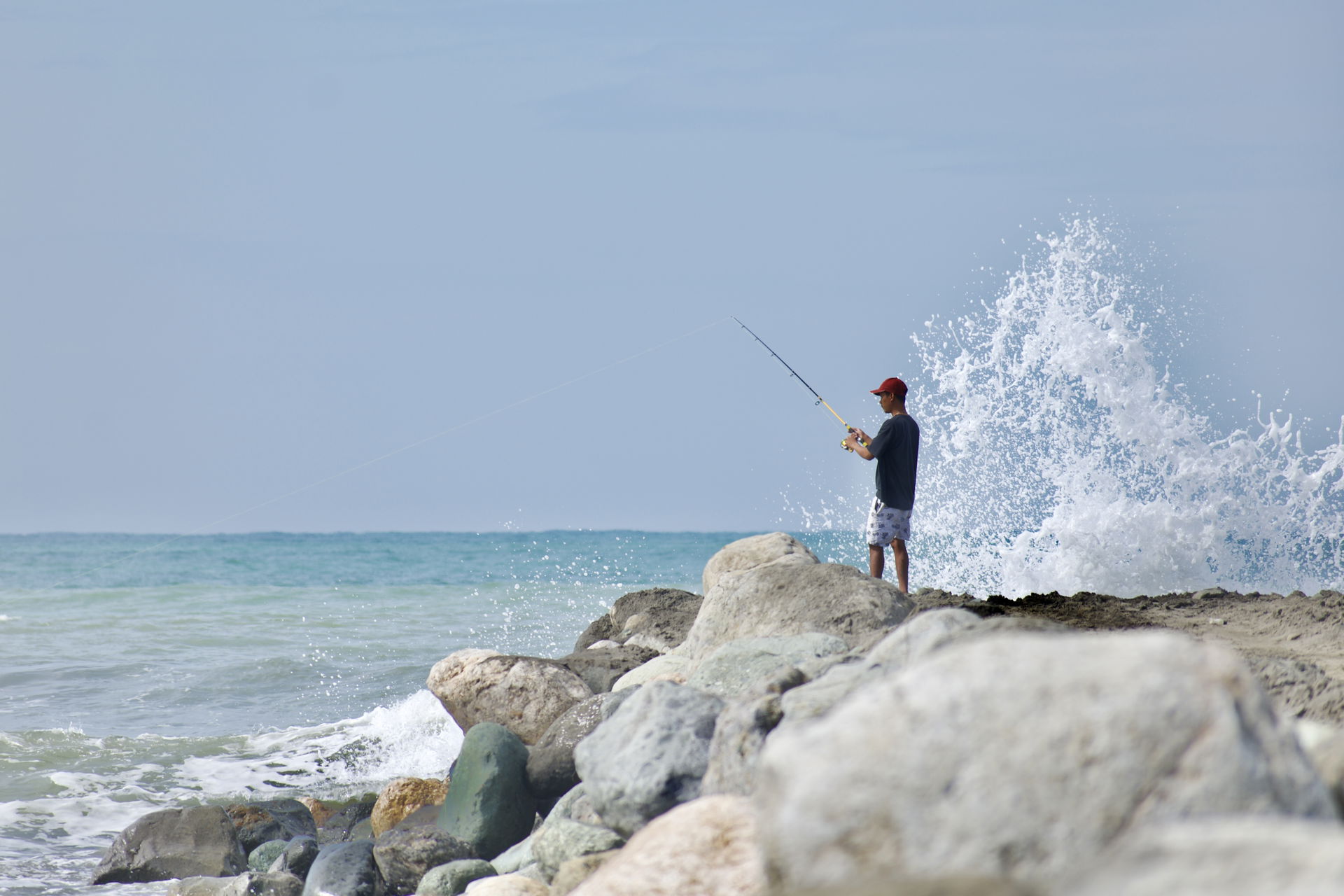 A man fishing by the beach of Agoo Eco Park, La Union. While fi…