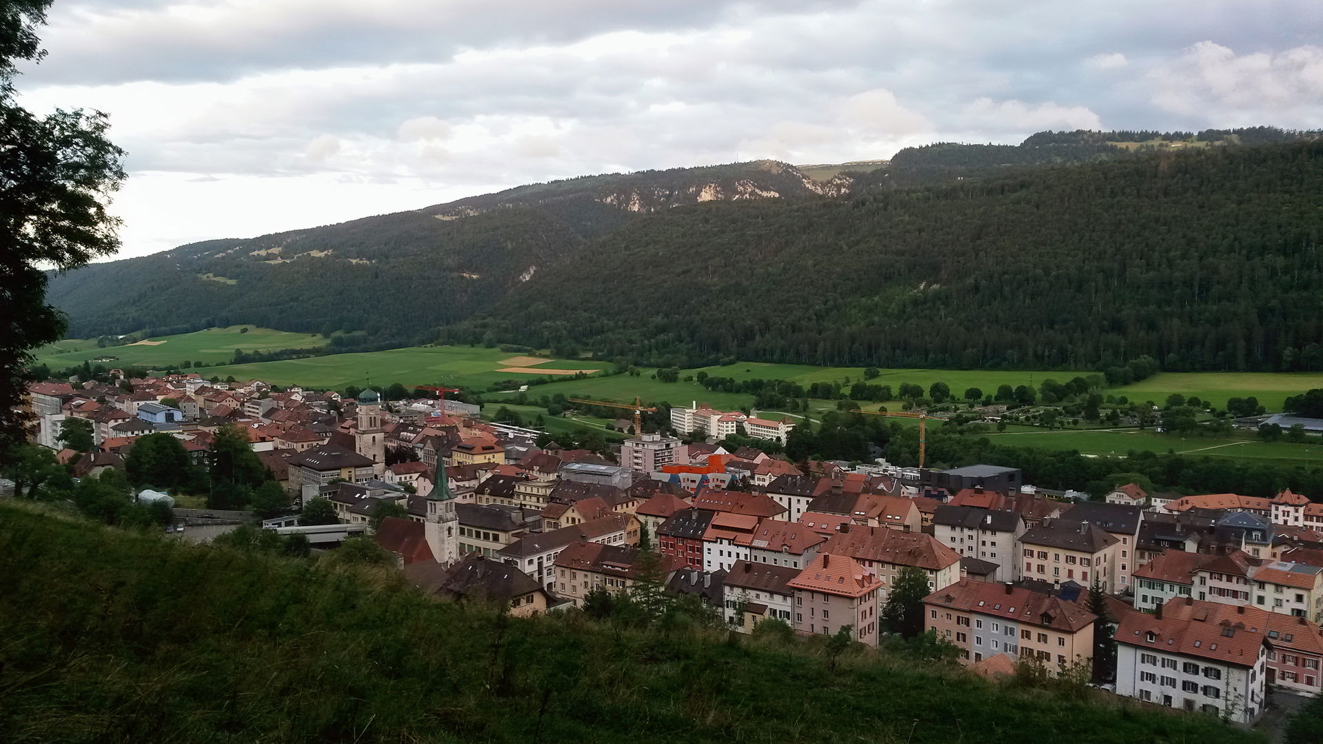 Saint Imier in the evening seen from the Mt. Soleil hillside lo…