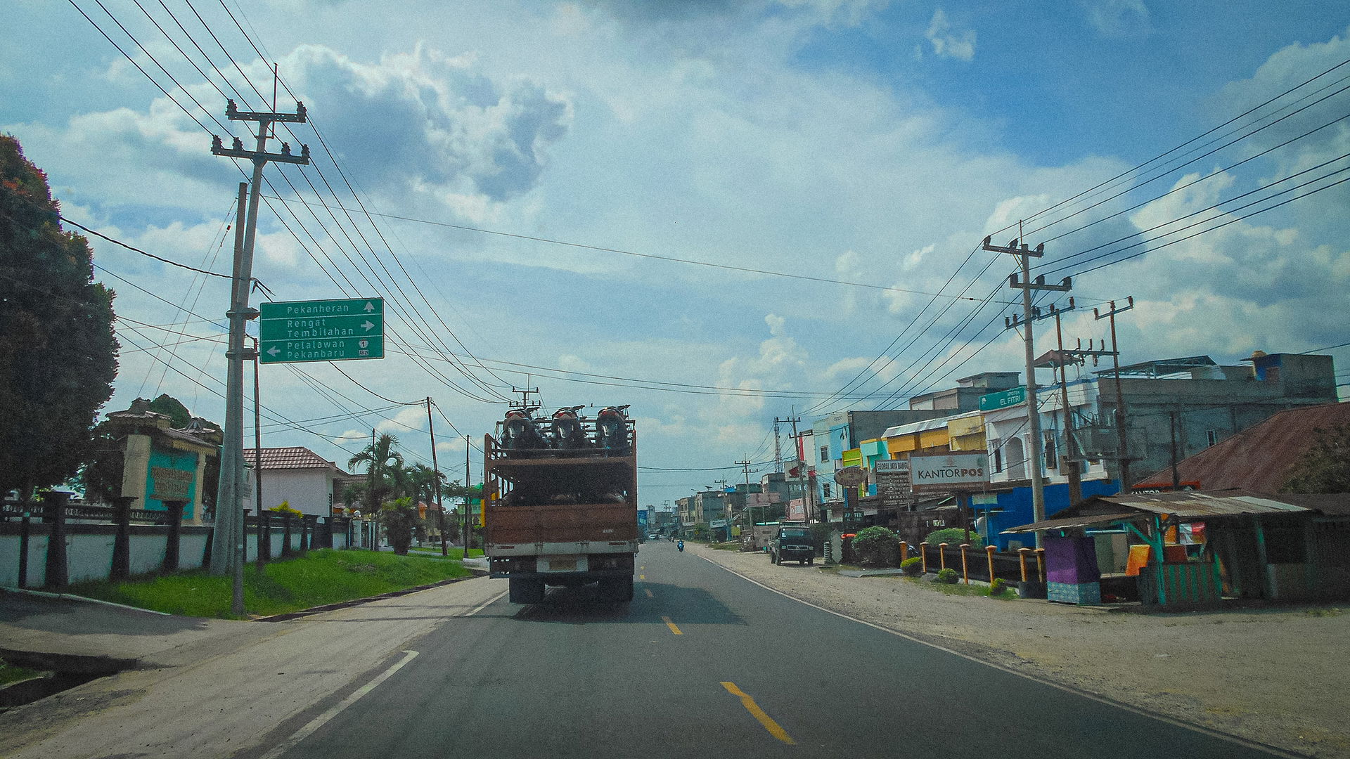 A main street of Trans-Sumatran East Highway in Pematang Reba, …