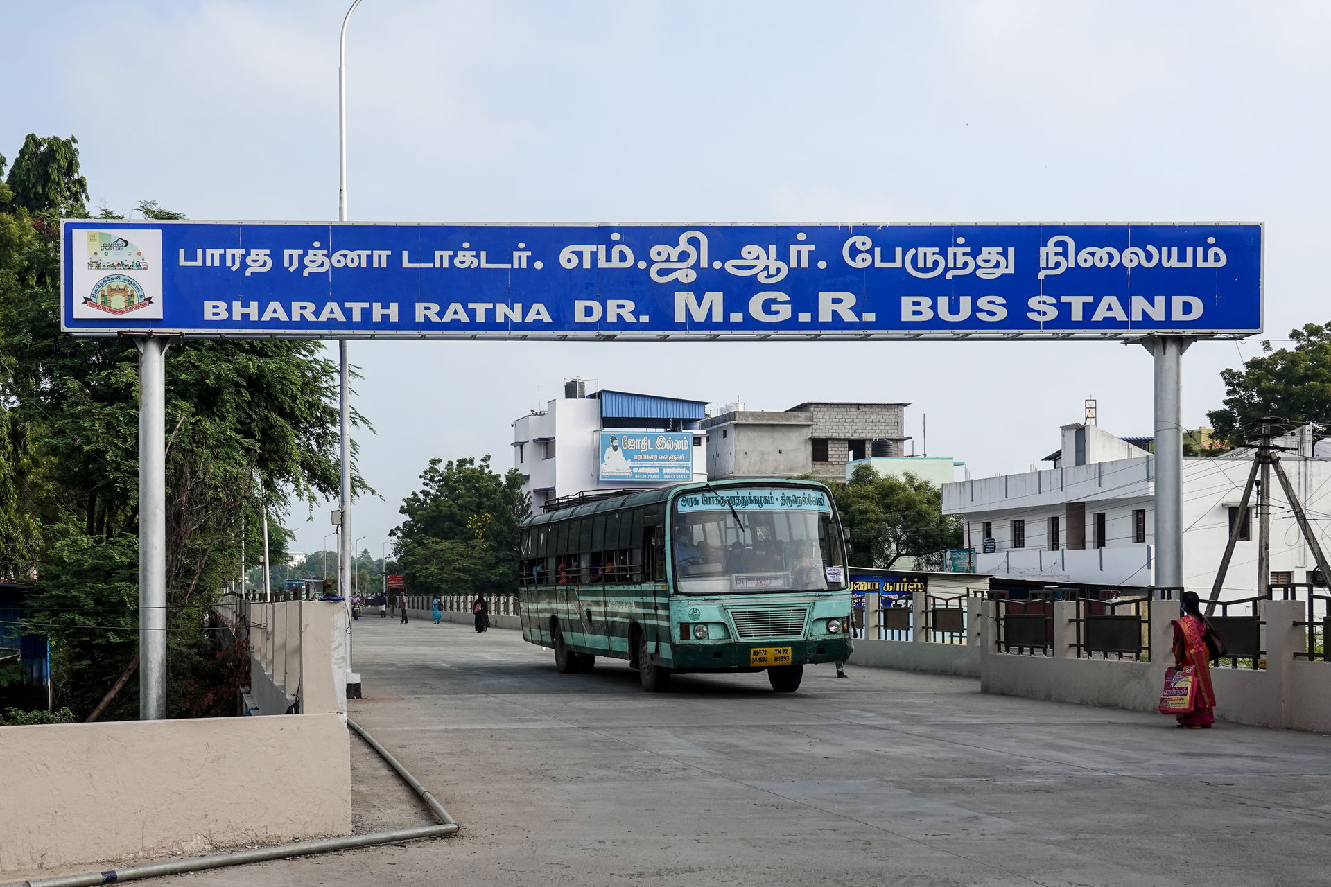 Entrance to MGR Bus Stand from NH7, bus departing, Tirunelveli,…
