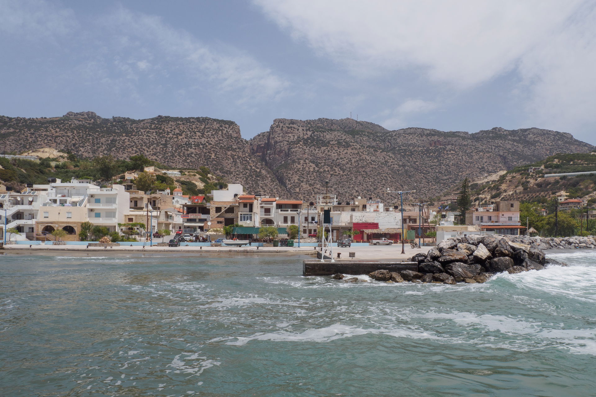The small harbour of Arvi. Behind the village can be seen the g…