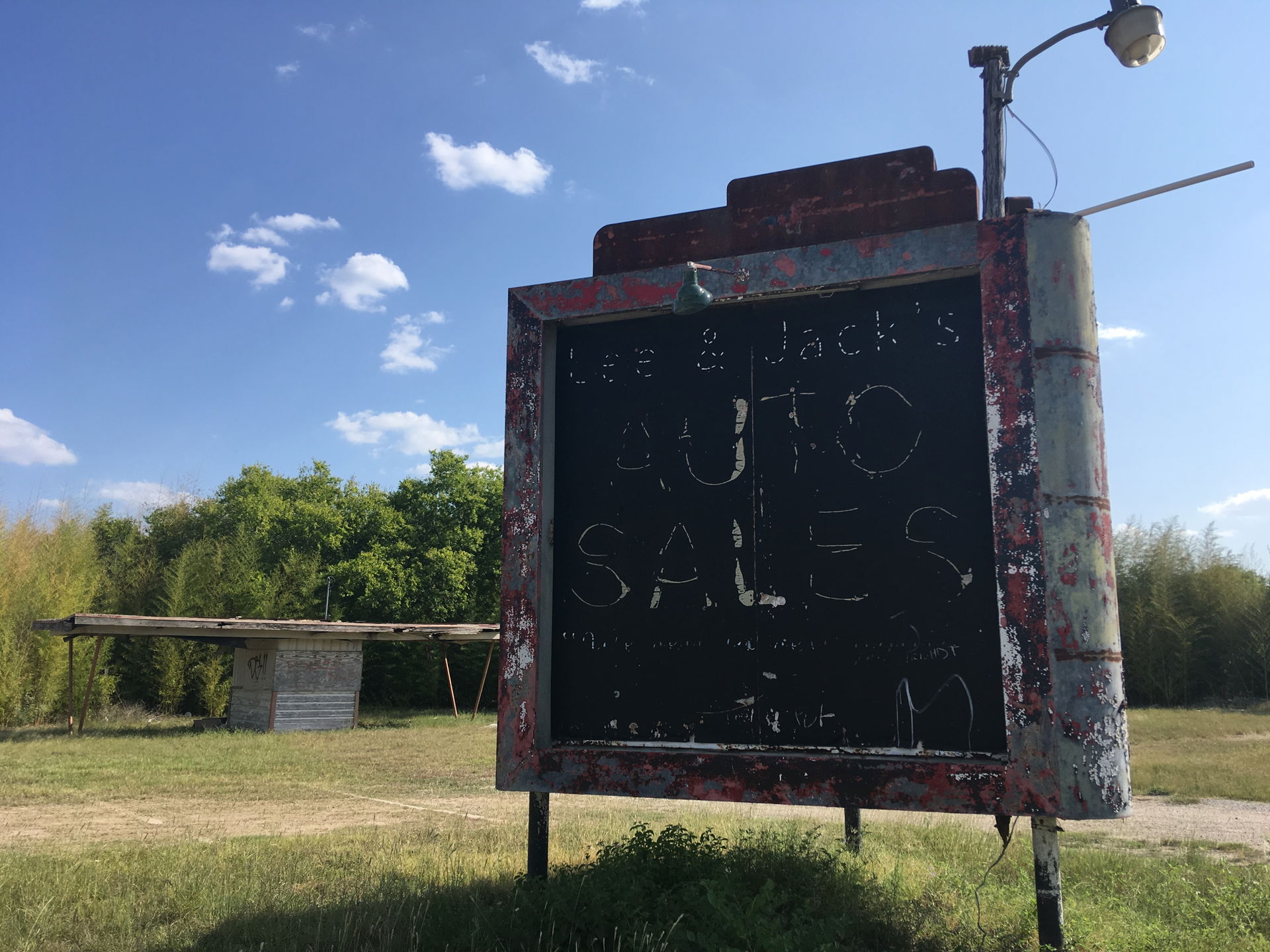 A decrepit car lot in Schertz Texas with interesting vintage si…