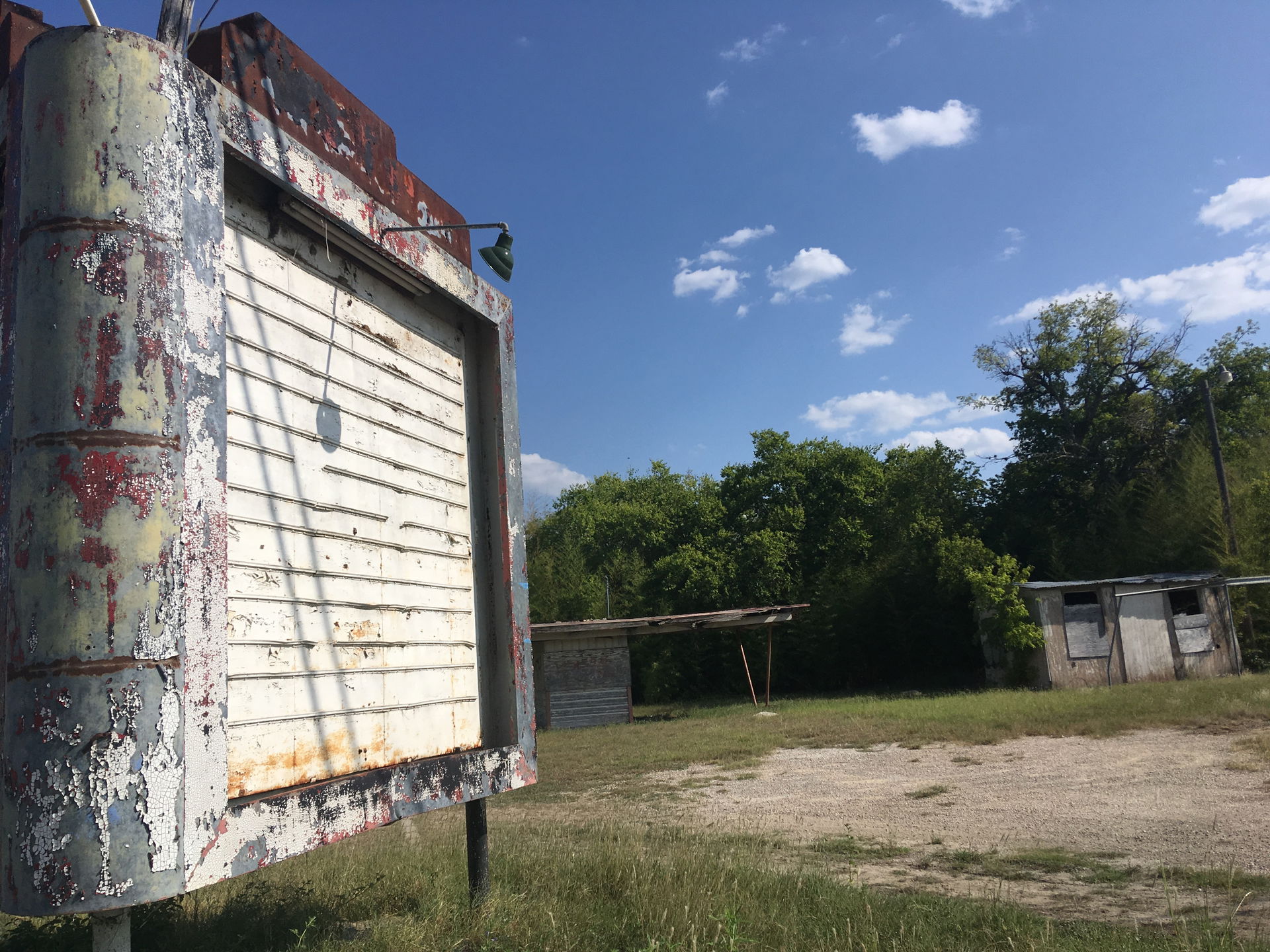 A decrepit car lot in Schertz Texas with interesting vintage si…