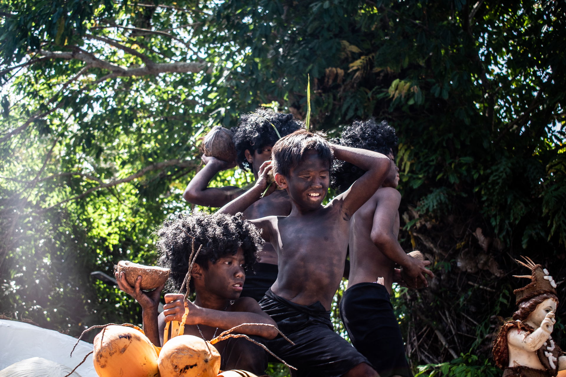 A young child dancing on a float during a parade at the Ati-Ati…