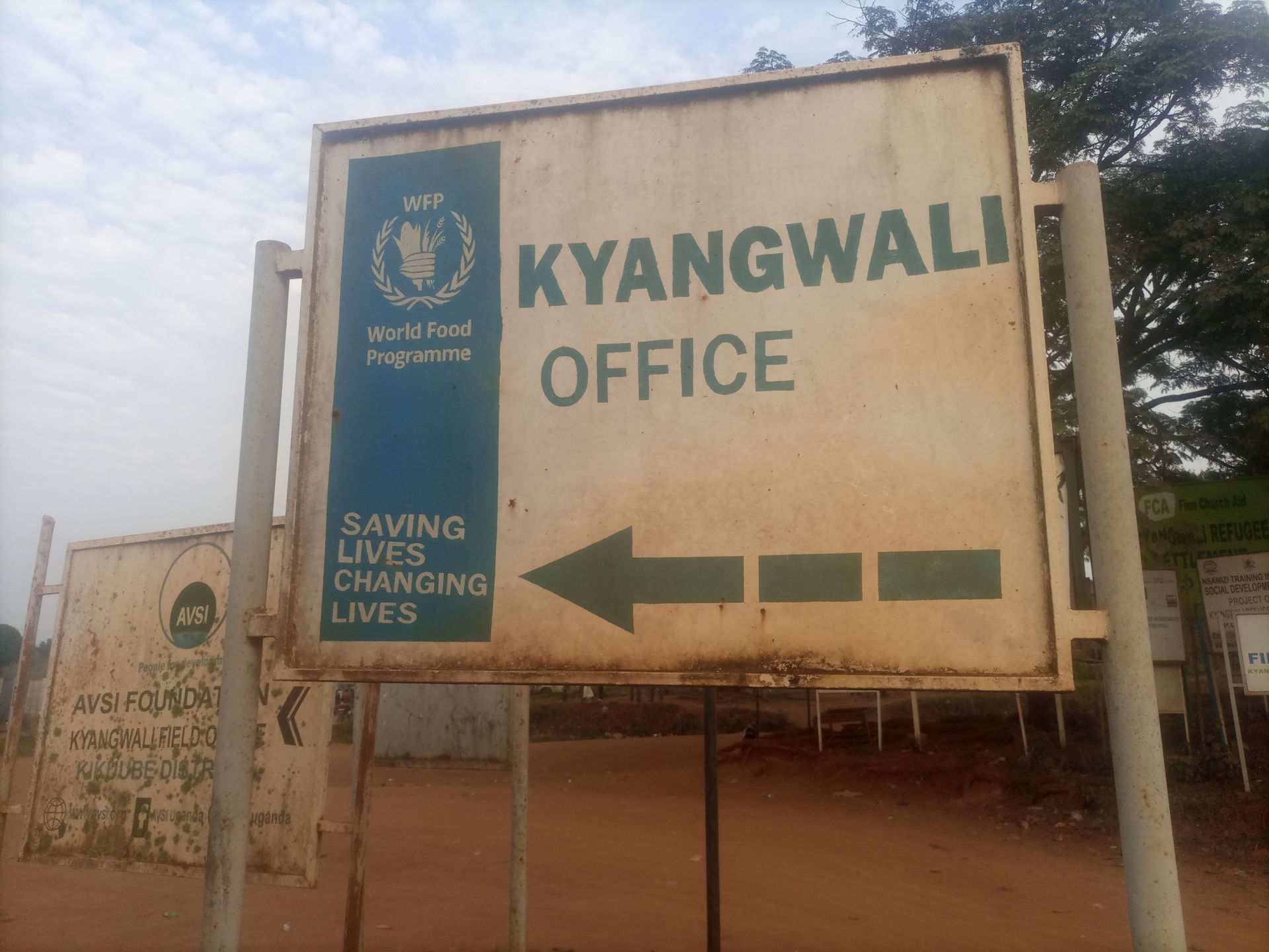 Directional signpost to World Food Program, Kyangwali office i…