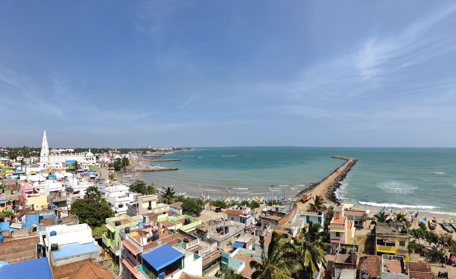 A View Of A Kanyakumari Beach And A Pier From A High Up.