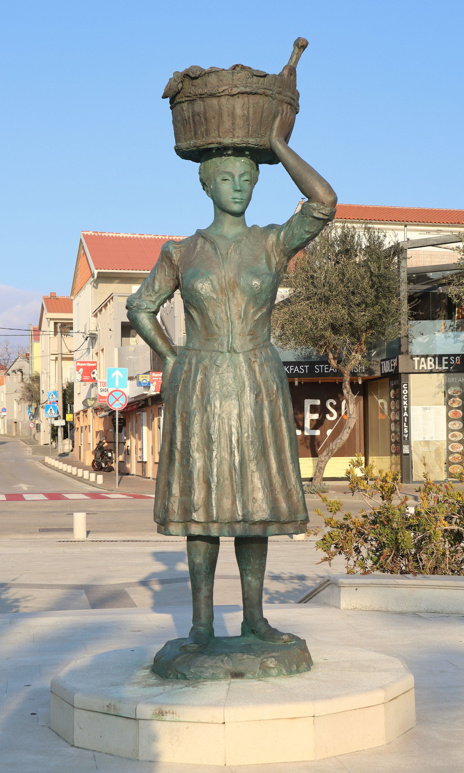 Bronze statue of a market woman in Novalja on the Island of Pag…