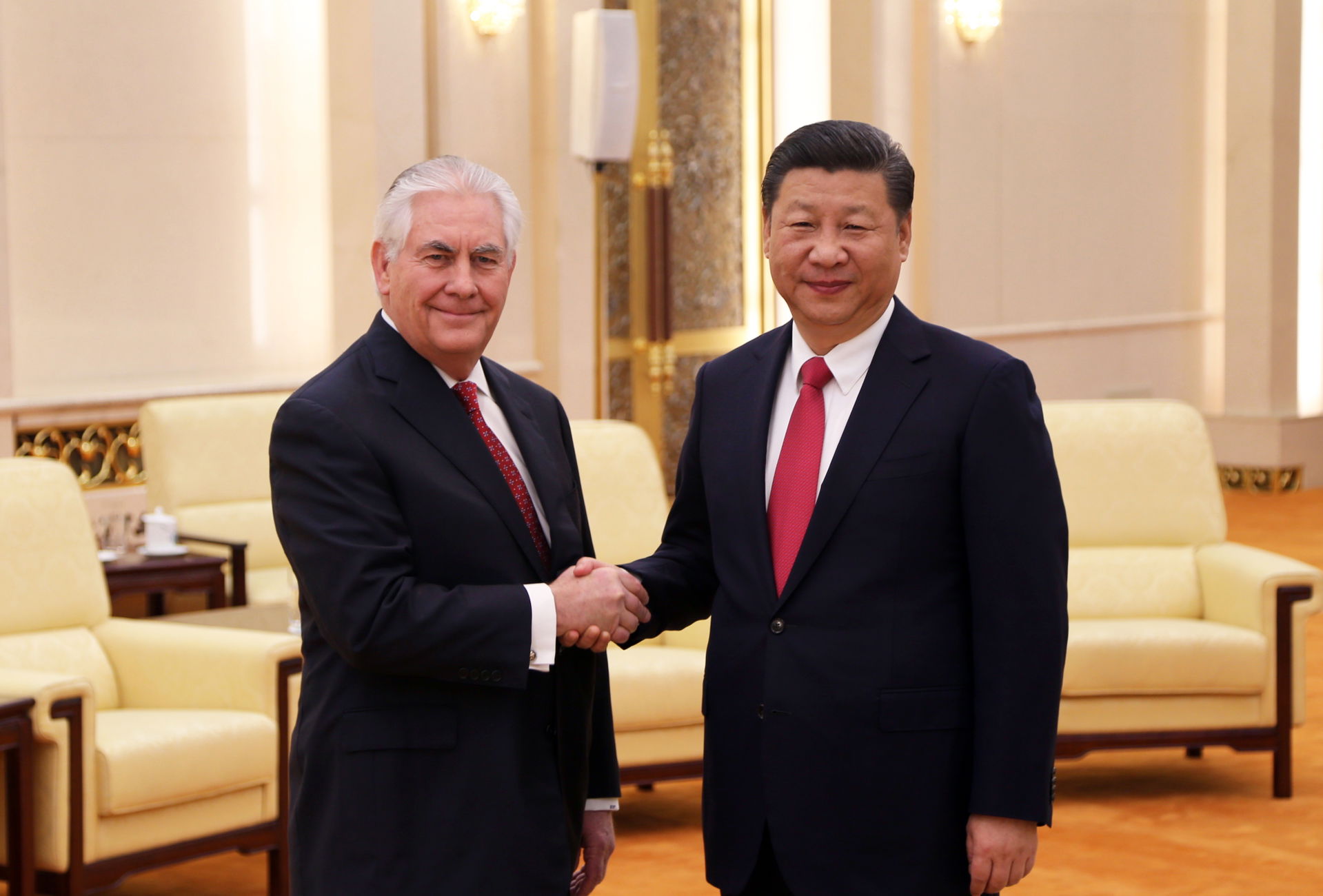 U.S. Secretary of State Rex Tillerson shakes hands with Communi…