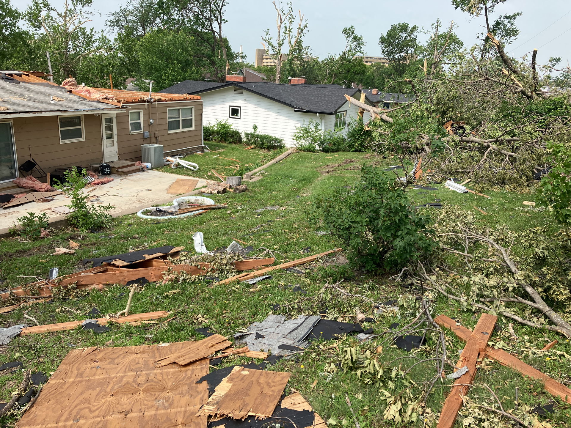 Heavy damage to homes and trees in Manhattan, Kansas.
"Standing…