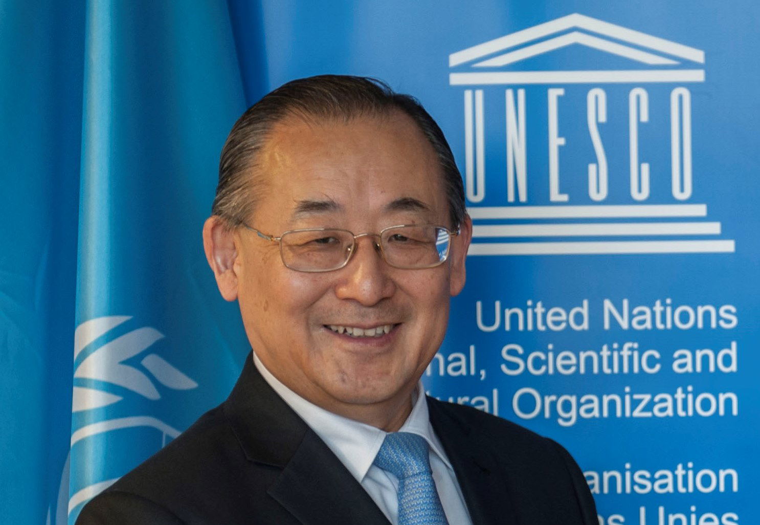This photograph of the Assistant Director-General for Education…