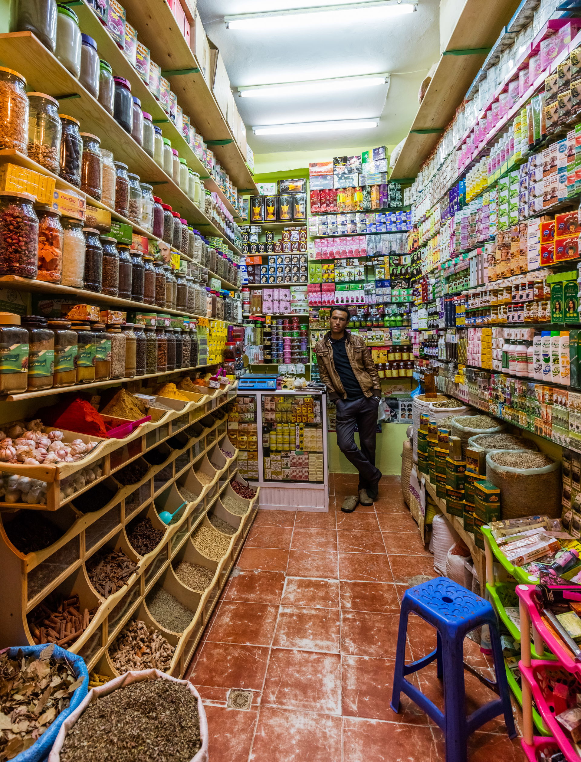 Seller posing in a grocery and cosmetics shop in the April 9th …