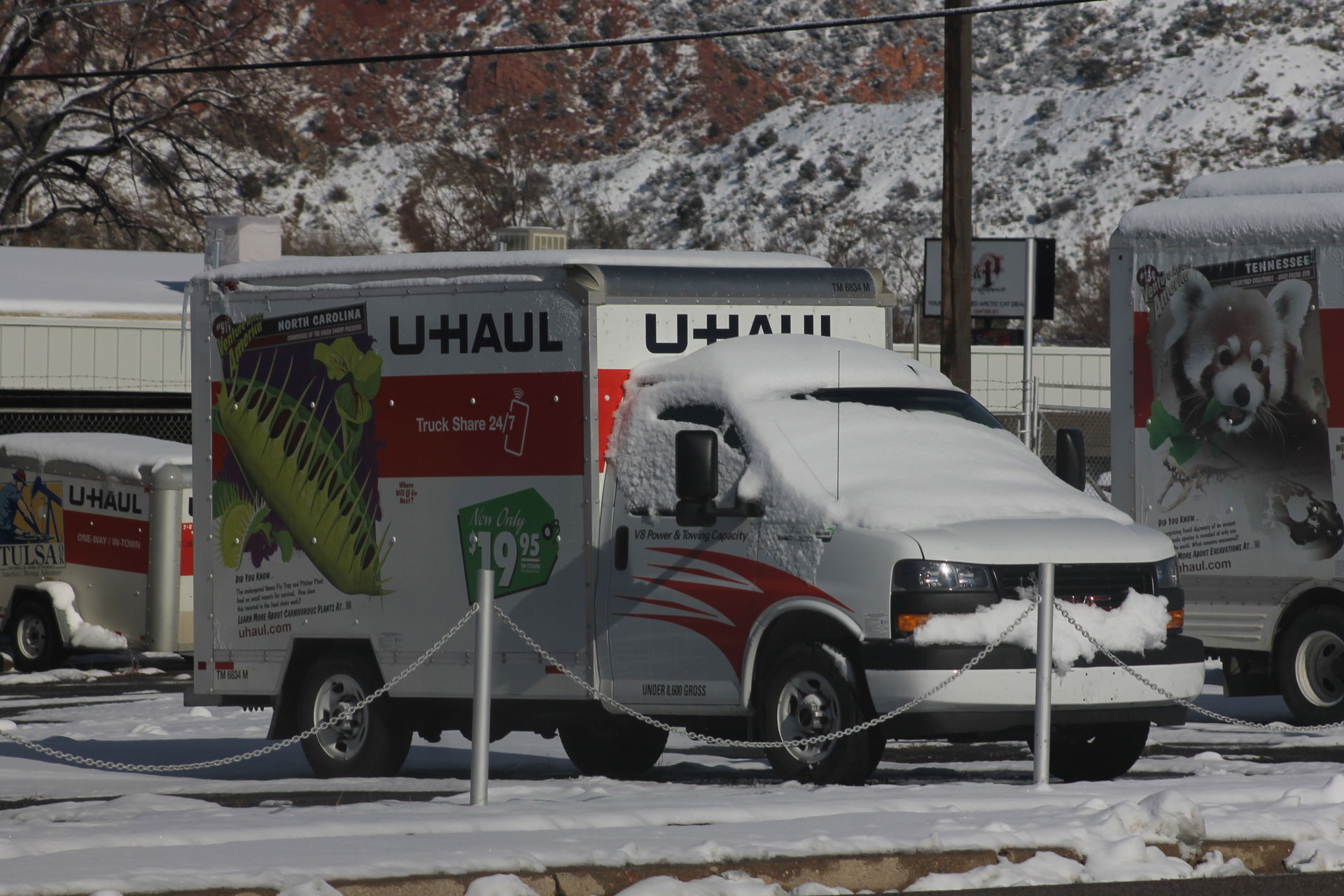 A snow covered GMC G-3500 U-Haul truck in Cedar City, Utah.