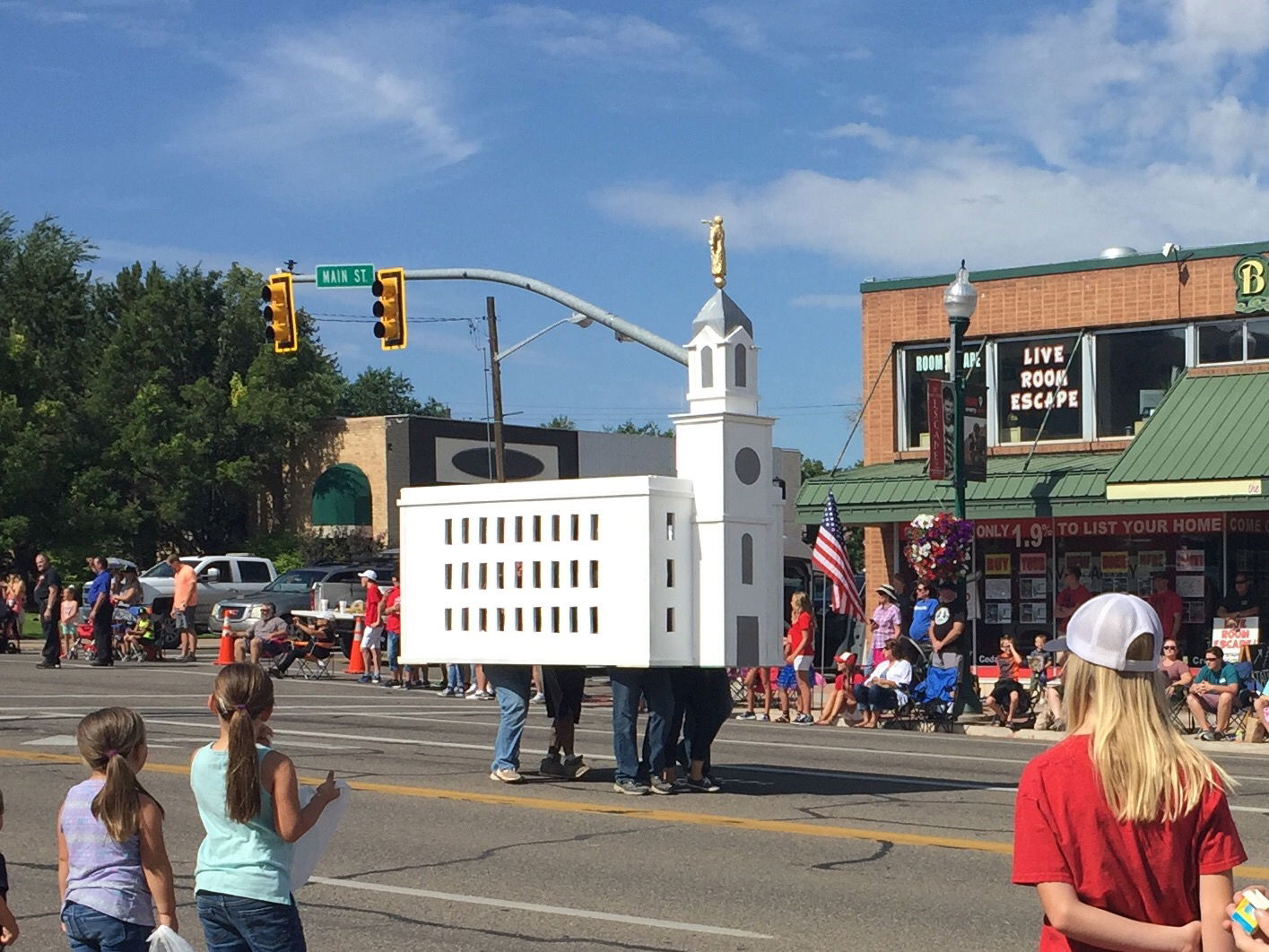 An LDS (Mormon) youth group carries a model of the Cedar City, …