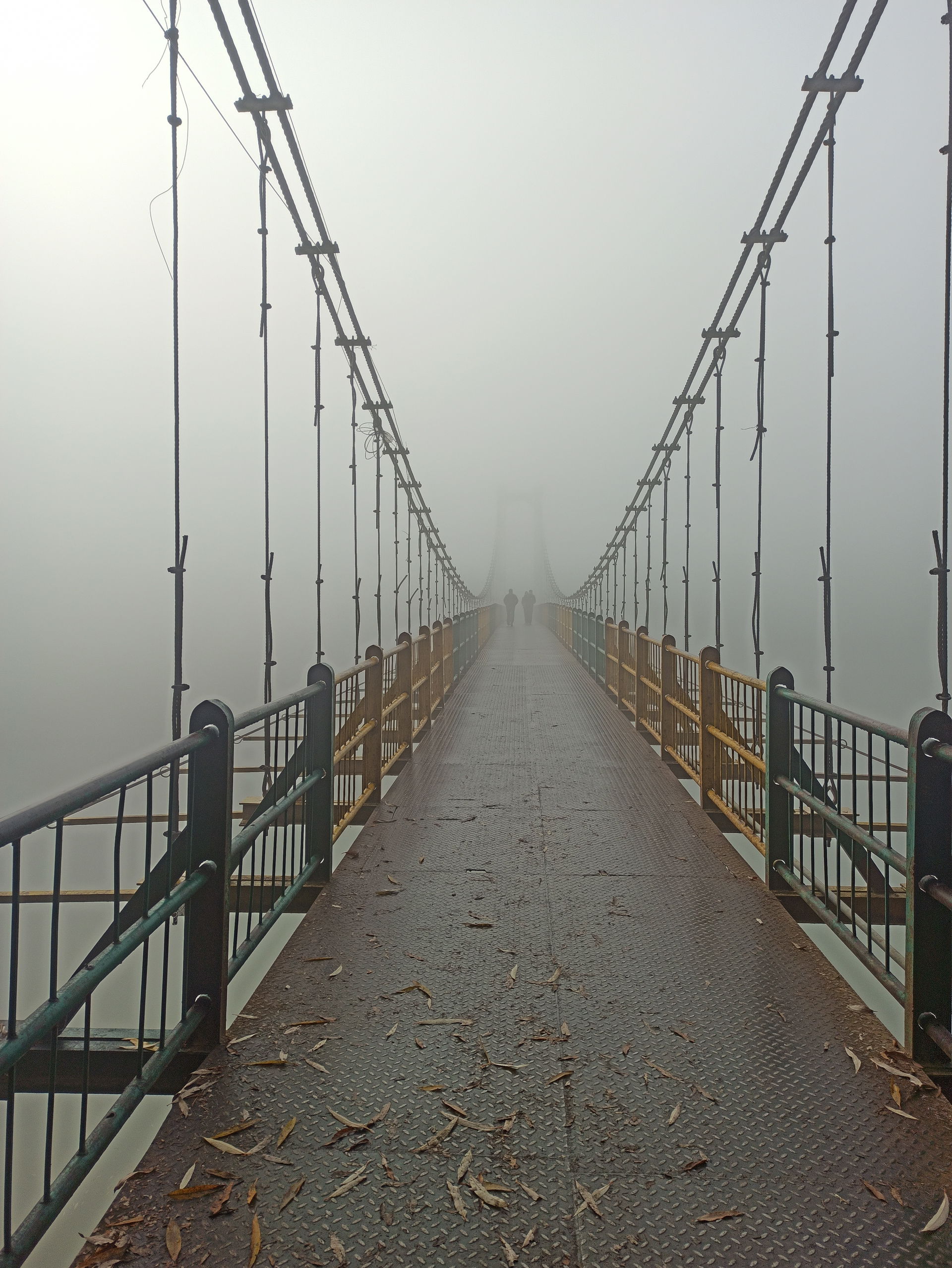 Suspension Bridge, Baramulla, India in fog in morning.