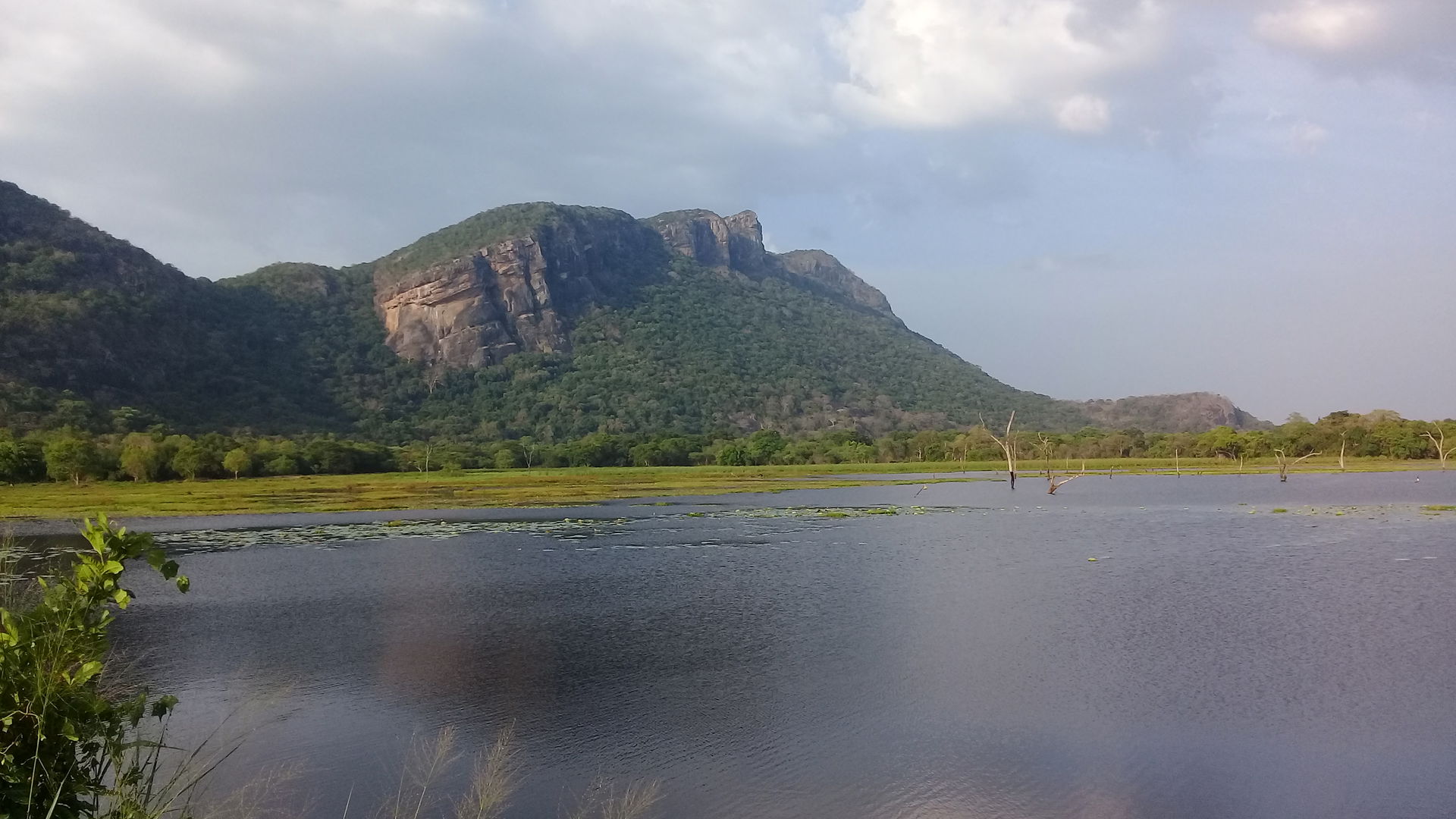 A view of last peak of the Dimbulagala hills across the lake.