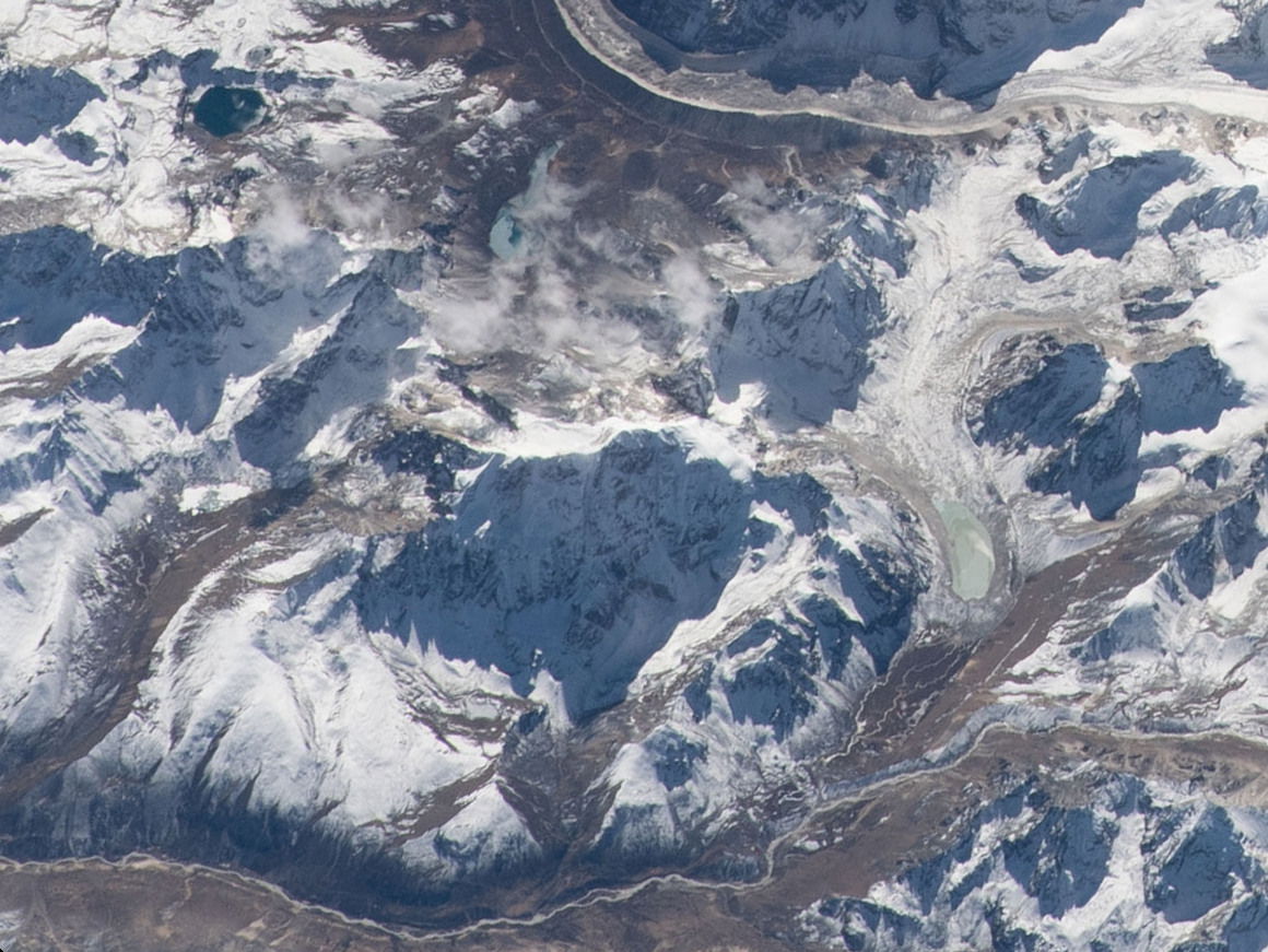 View of China taken during ISS Expedition 66. Mountains Tolakan…
