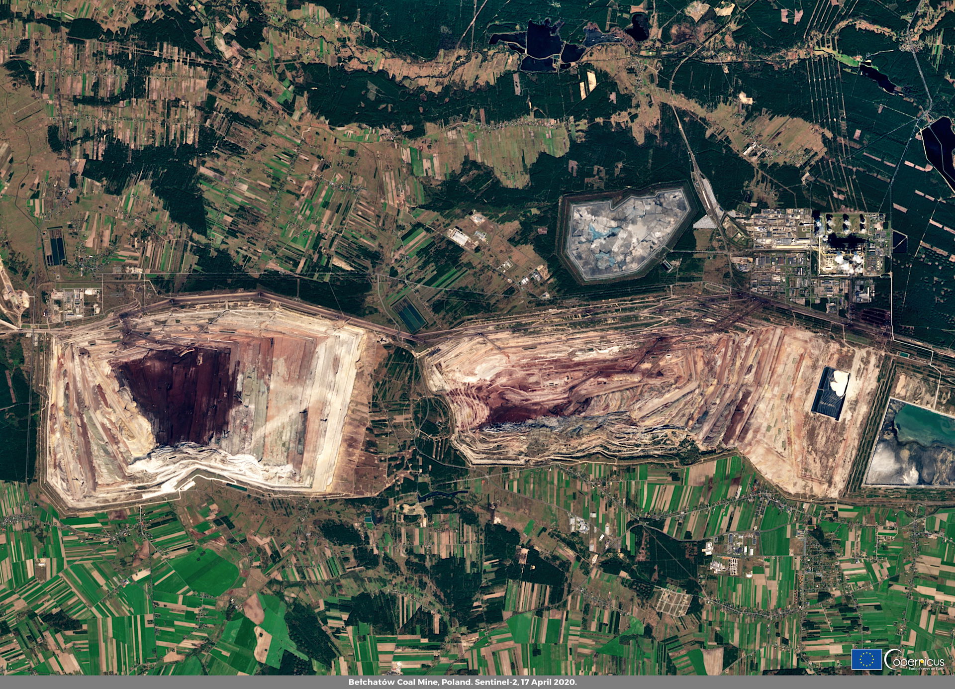 The Bełchatów coal mine is a large open-pit extraction facility…