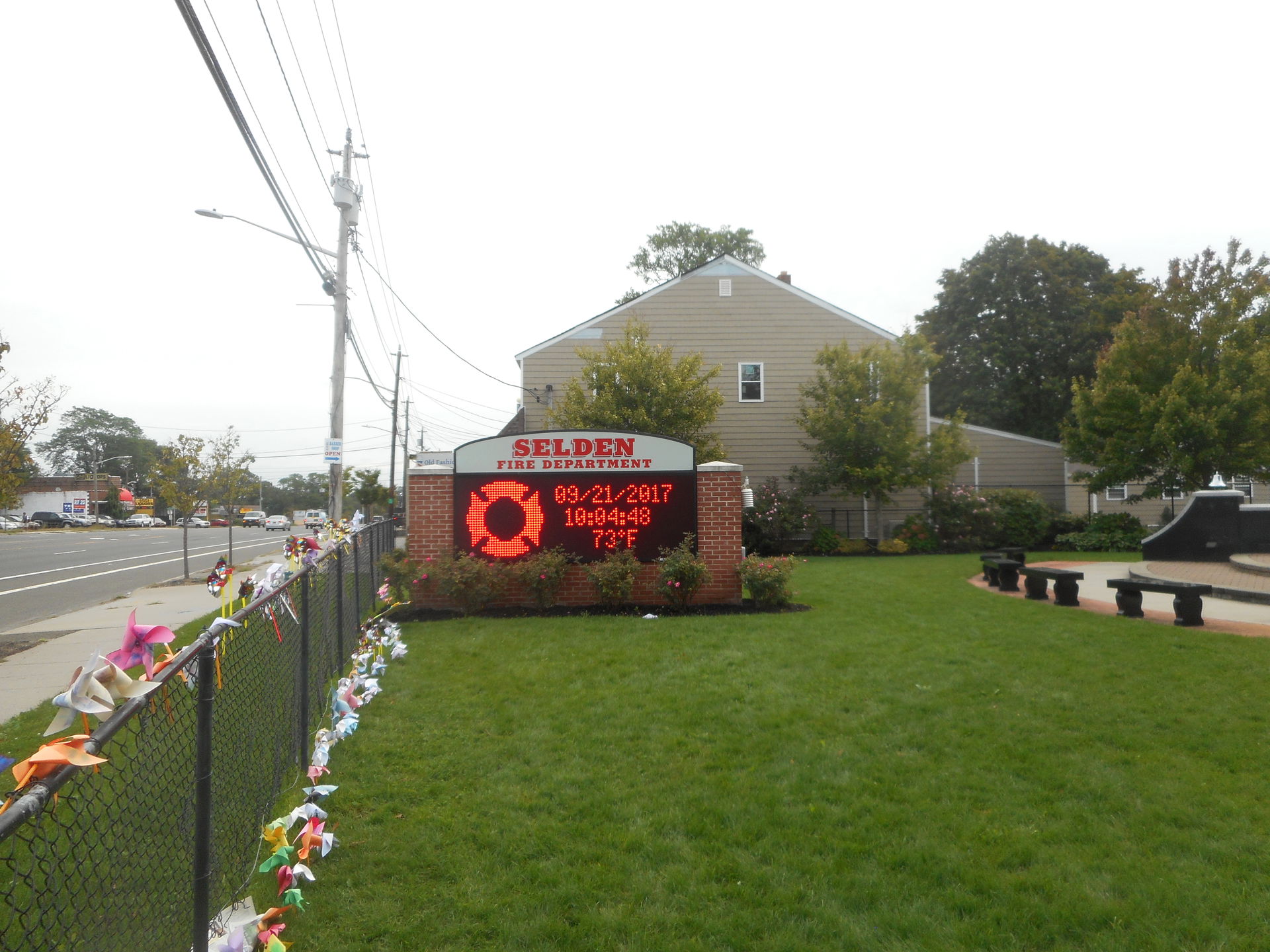 Sign along the eastbound sidewalk of New York State Route 25 fo…