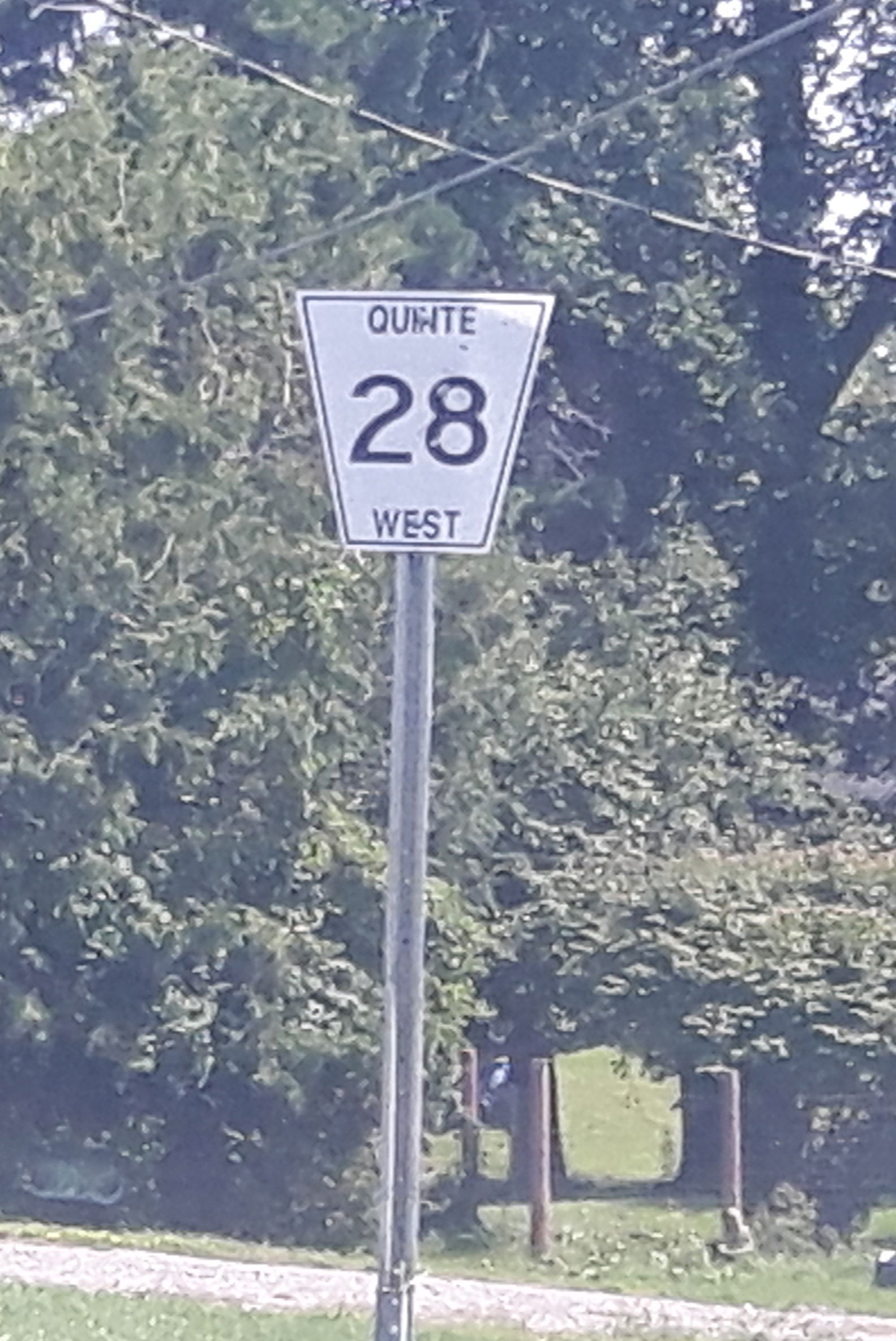 This is a photograph of a city route marker of route 28 in the …