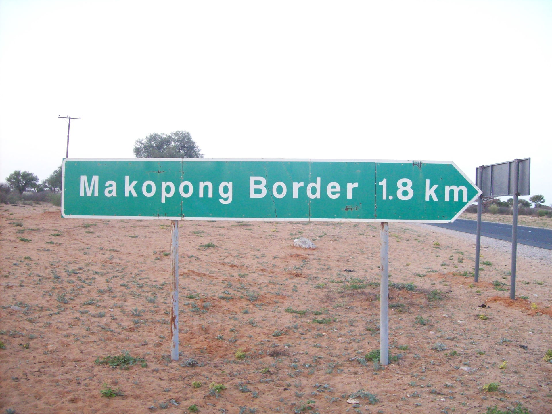 The Makopong Border Post sign. It is located along the main roa…