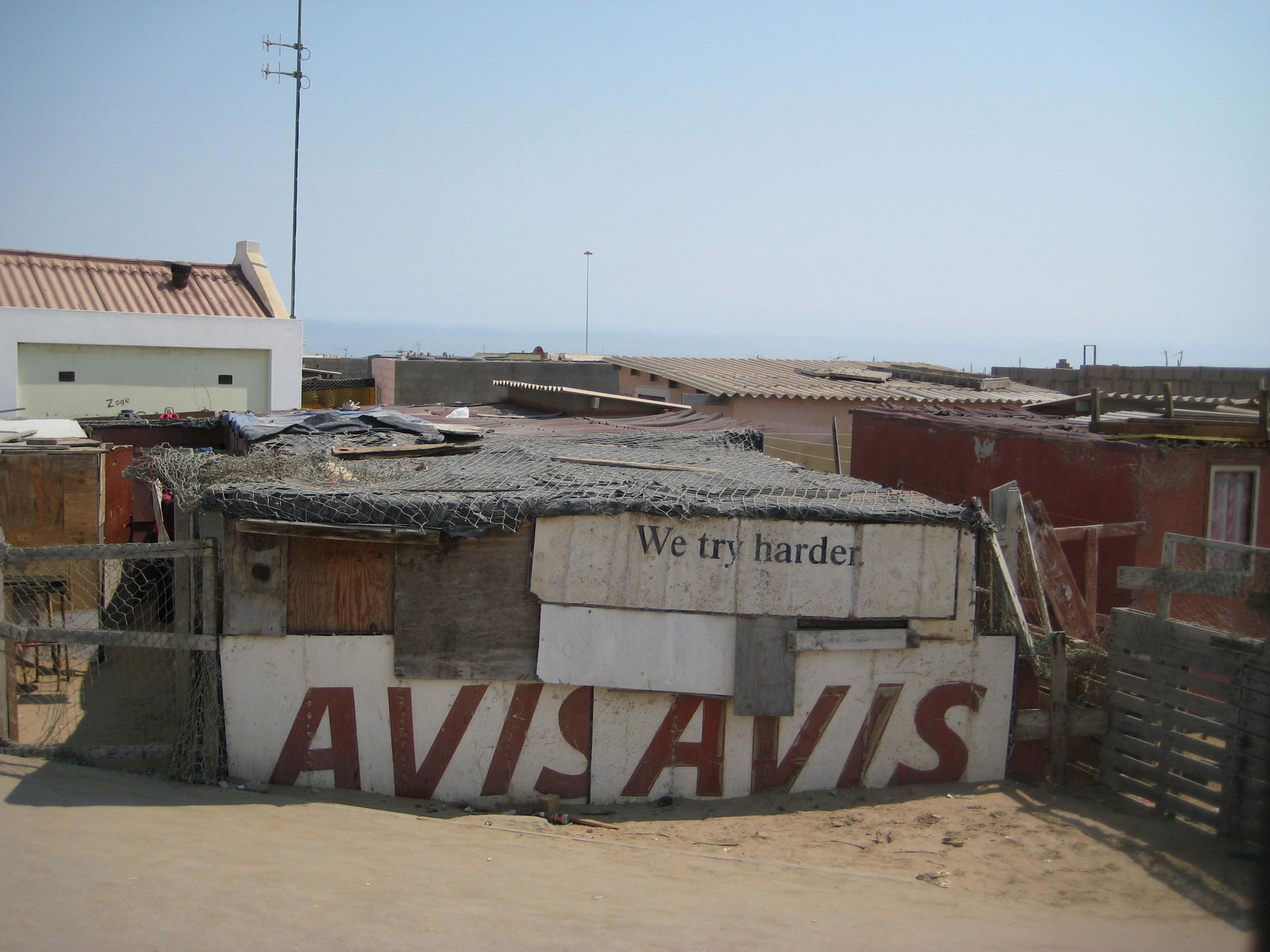 Message "We try harder" in an informal settlement of Oshakati,…