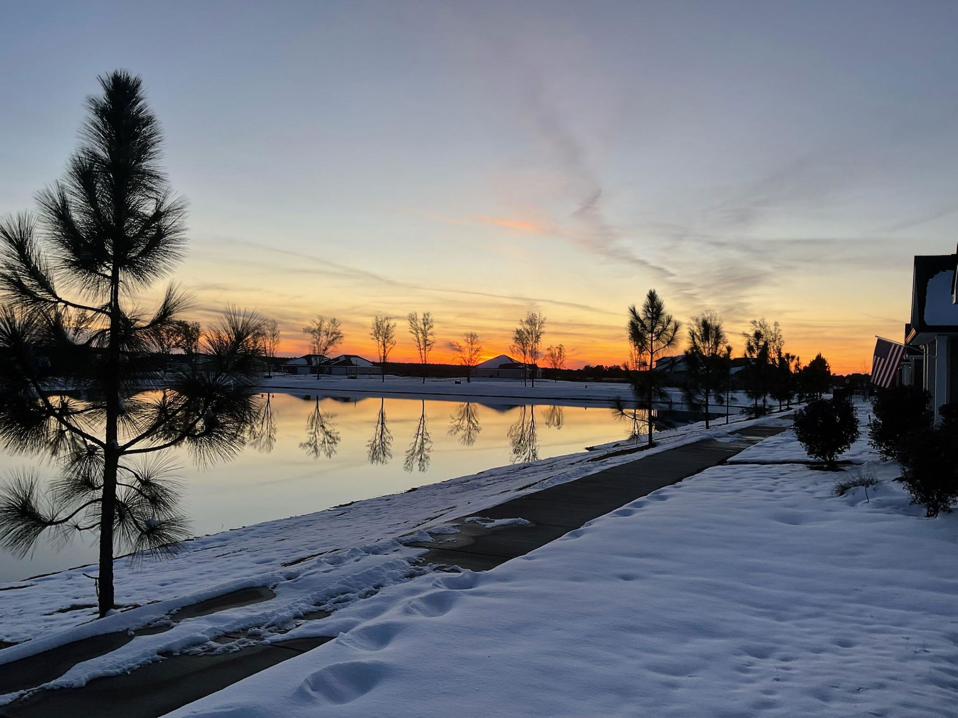 A sunset with snow on the ground from Milton, Florida, USA.