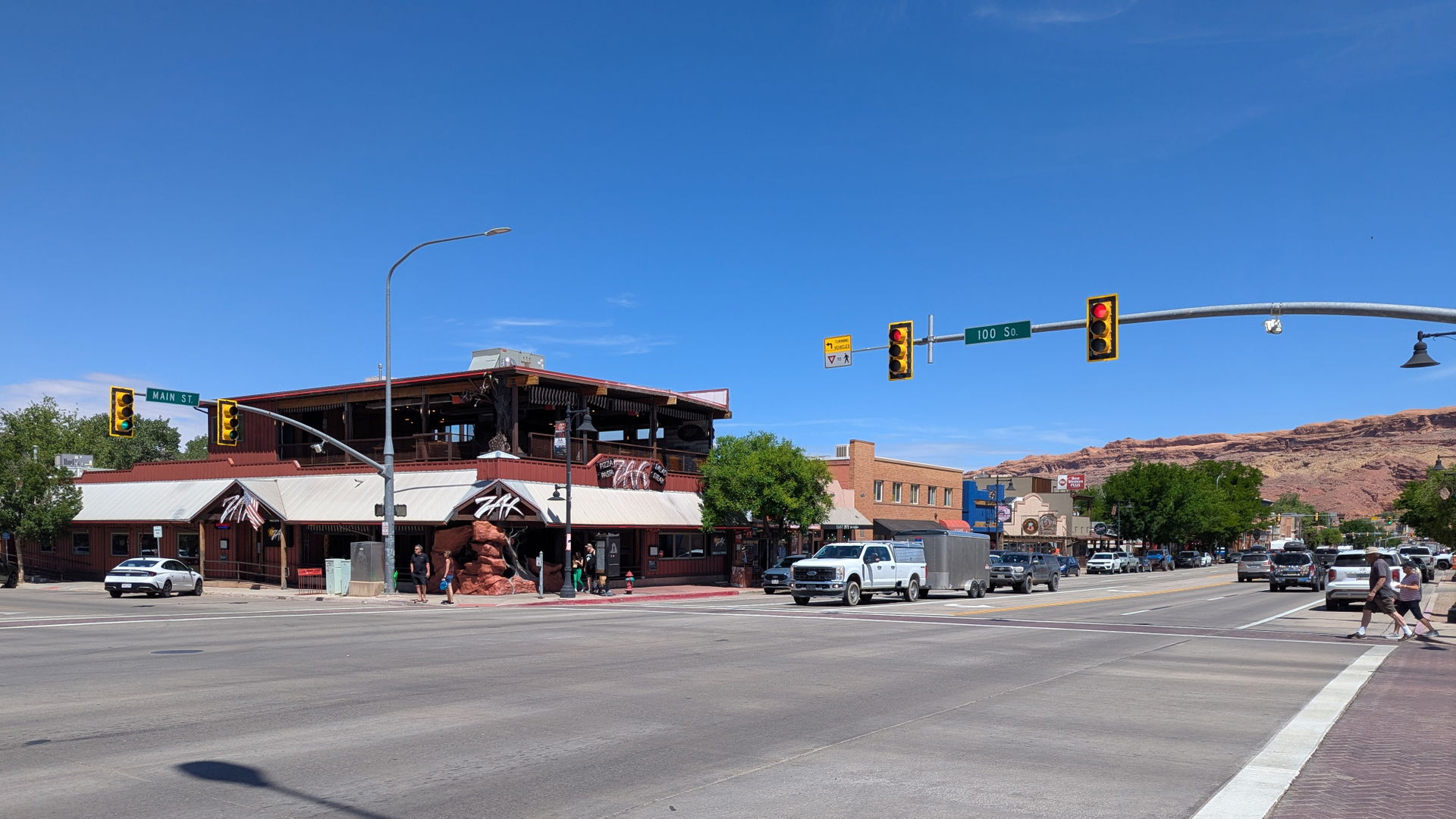 Looking diagonally across 100 South and Main St at Zax Pizza, P…