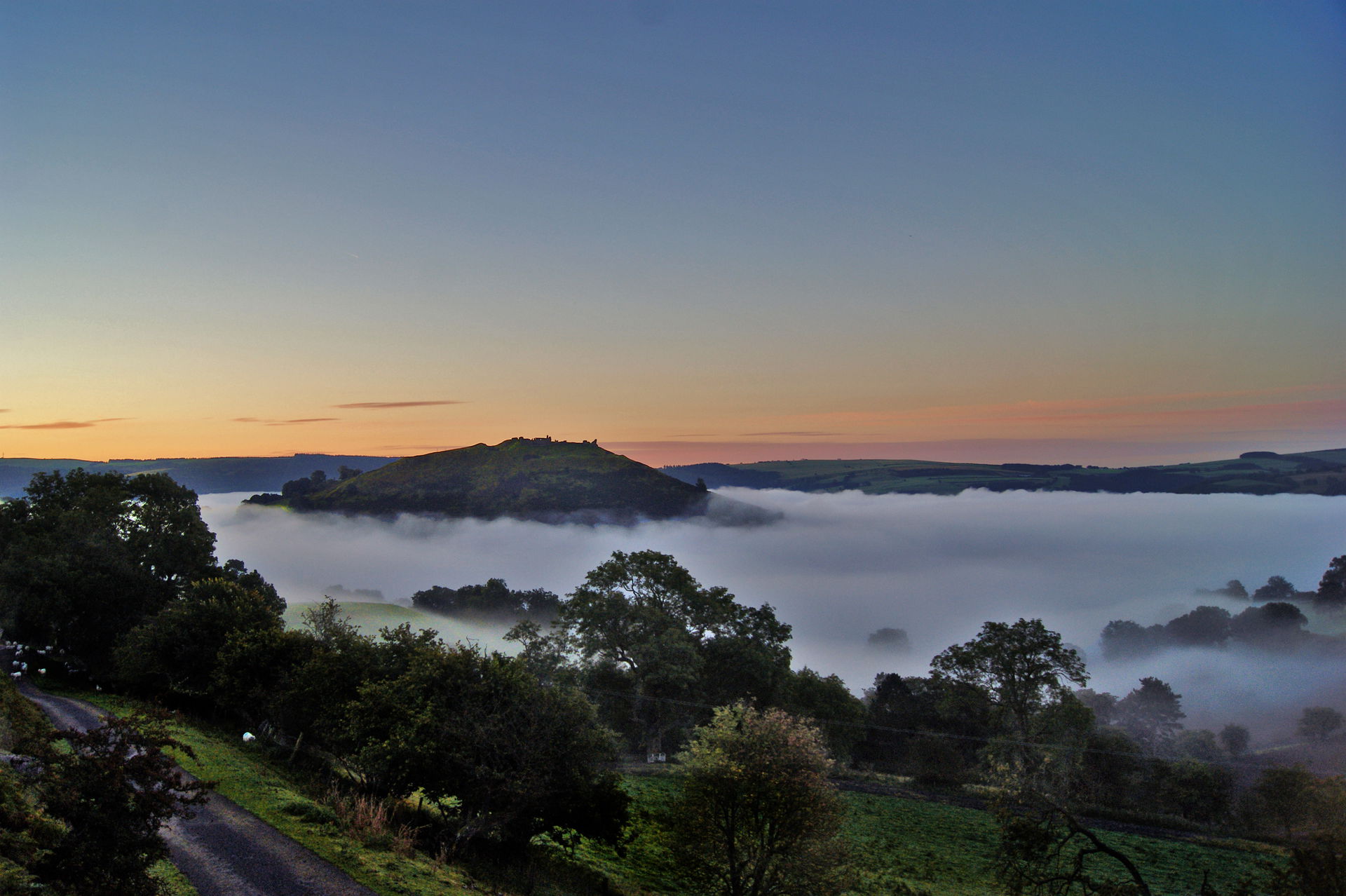 Castell Dinas Brân standing out above the fog that filled the V…
