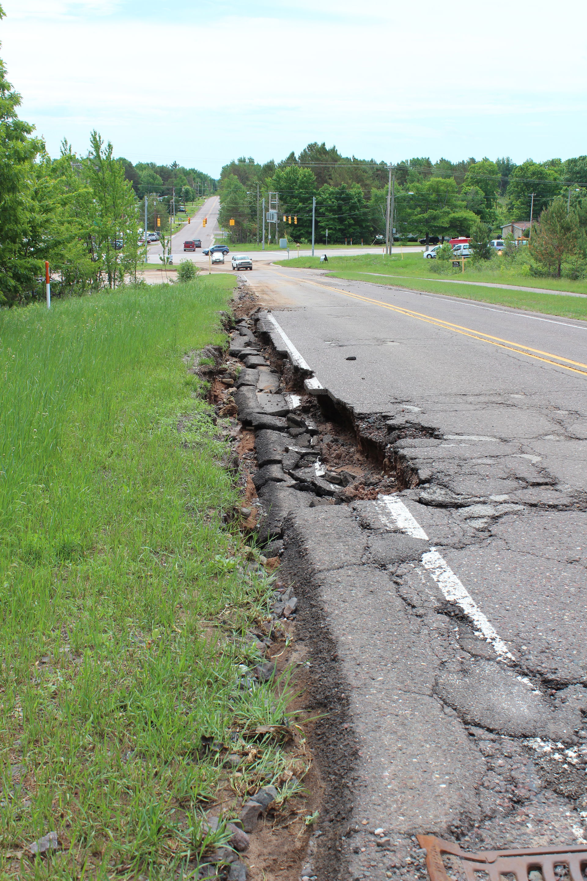 A damaged section of Sharon Avenue in Houghton, Michigan, on Ju…