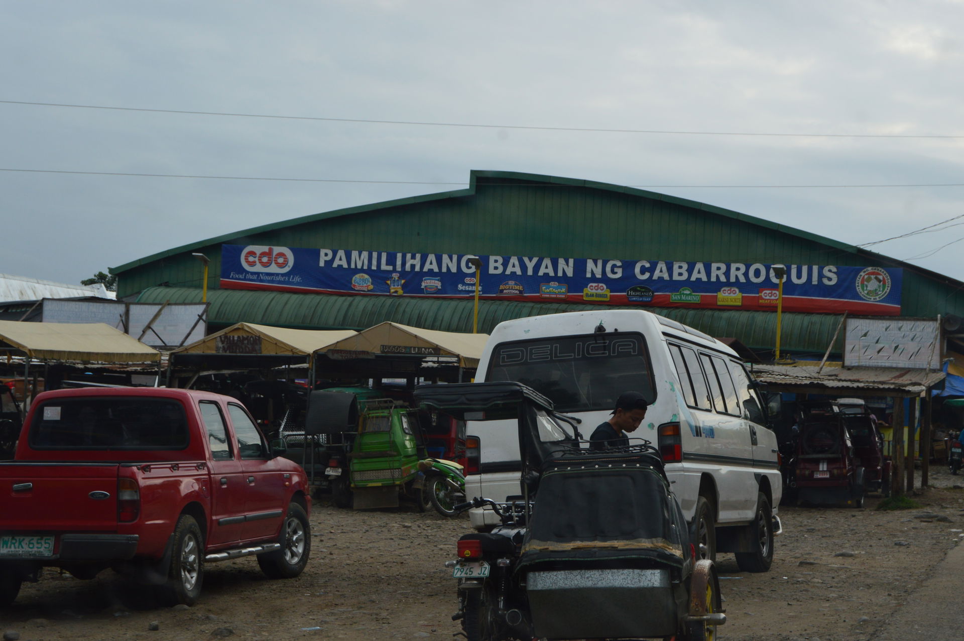 Photo shows the facade of the Cabarroguis Public Market in the …