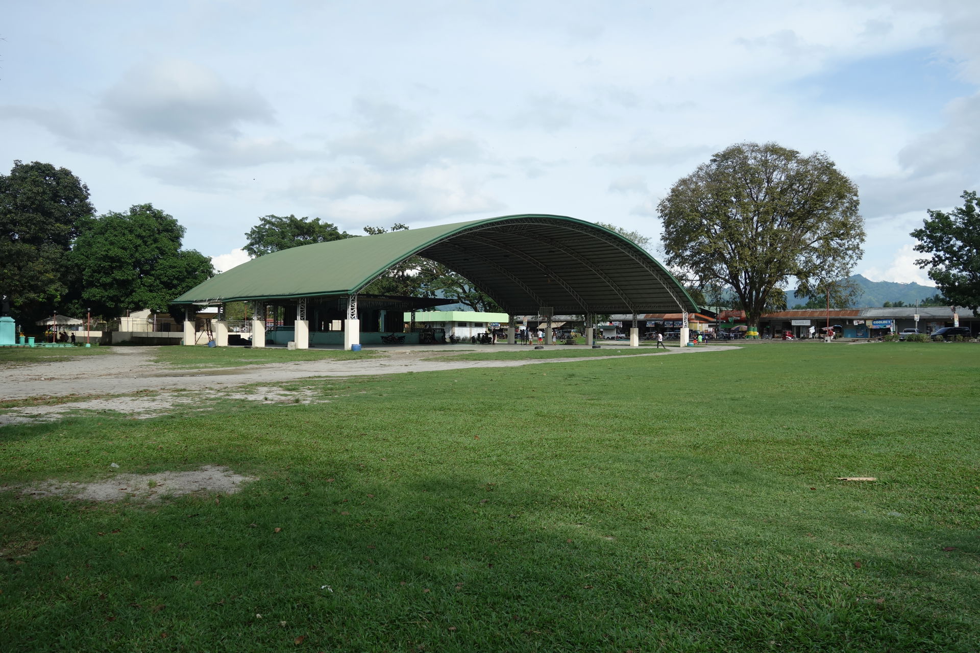 The sheltered basketball court and stage at the south end of th…