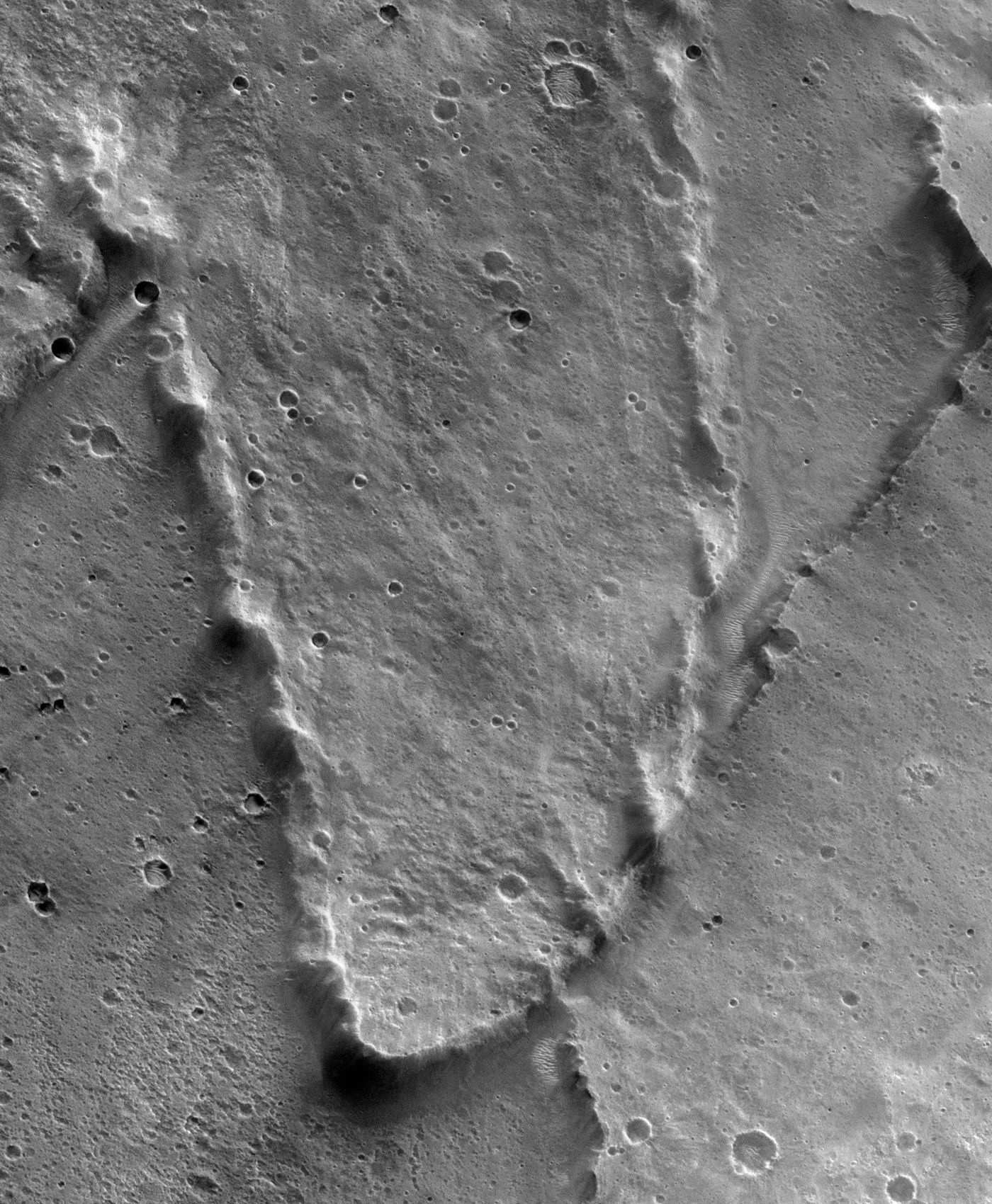 Ejecta lobe of Yuty crater, clearly showing the rampart along t…