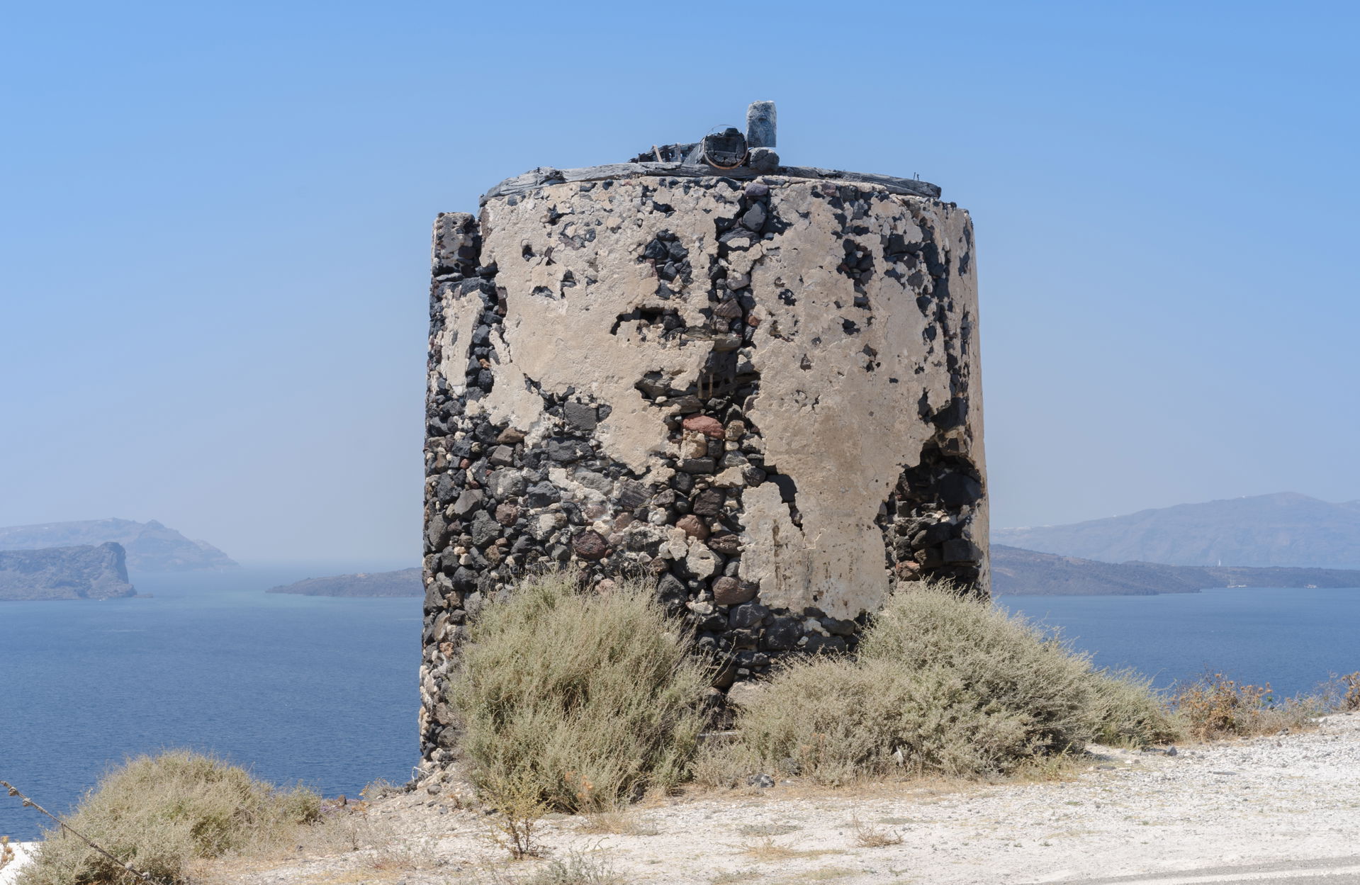 Remains of a windmill at the crater rim near Akrotiri, Santorin…