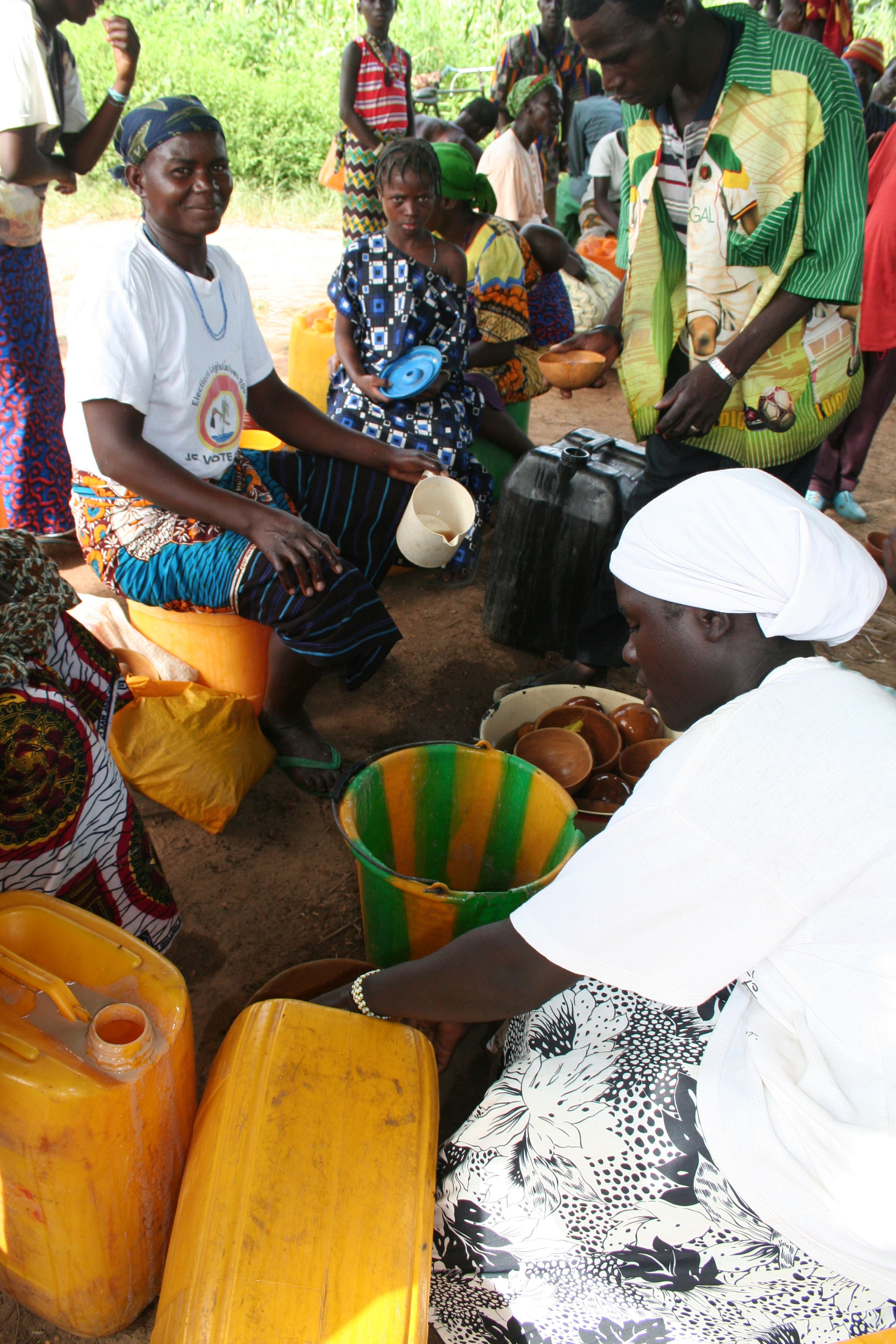 serving Sorghum beer (Dolo) on a Market in Tapoadjerma, Burkina…
