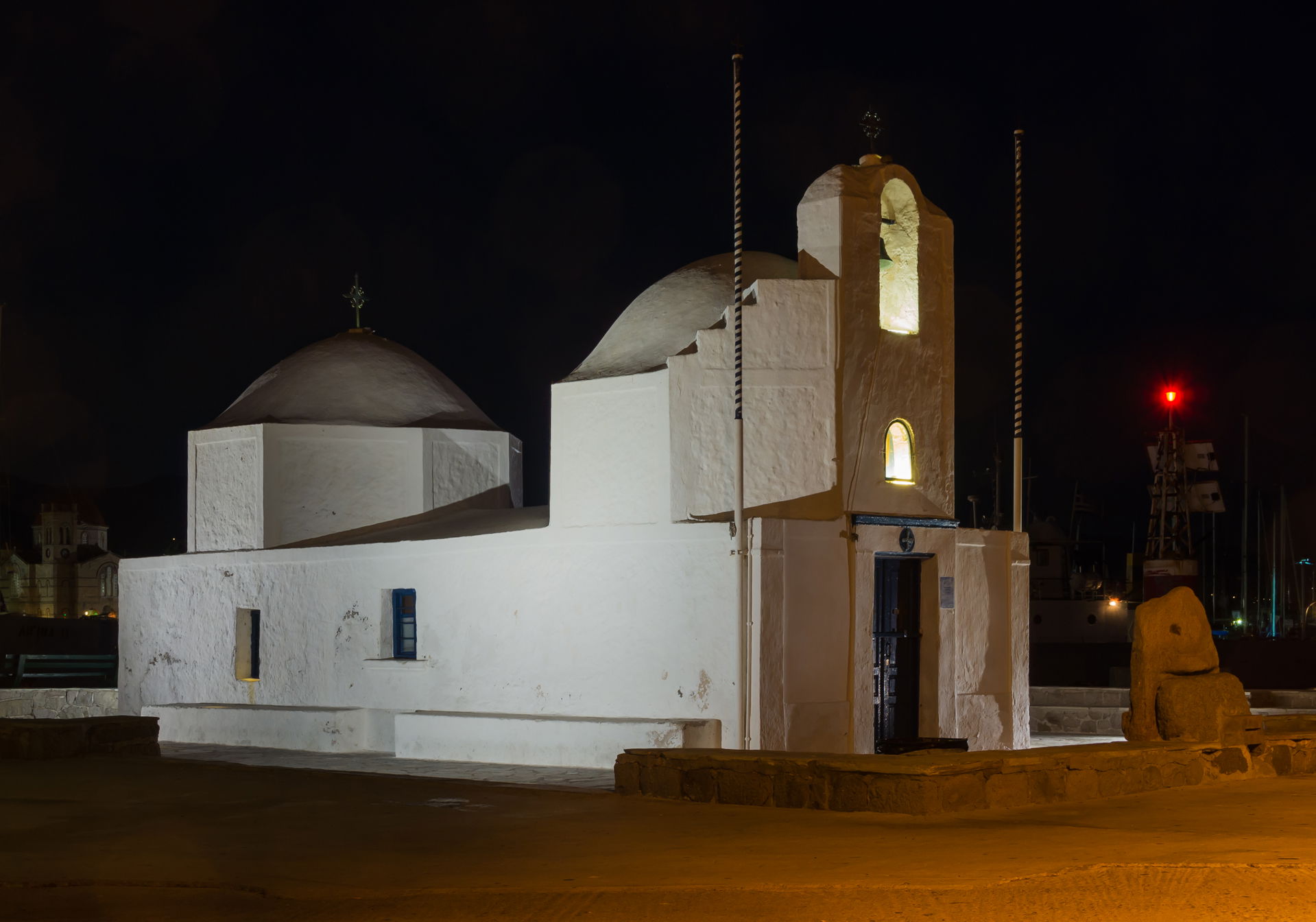 Night view of the chapel of the harbour, Aegina, Greece.