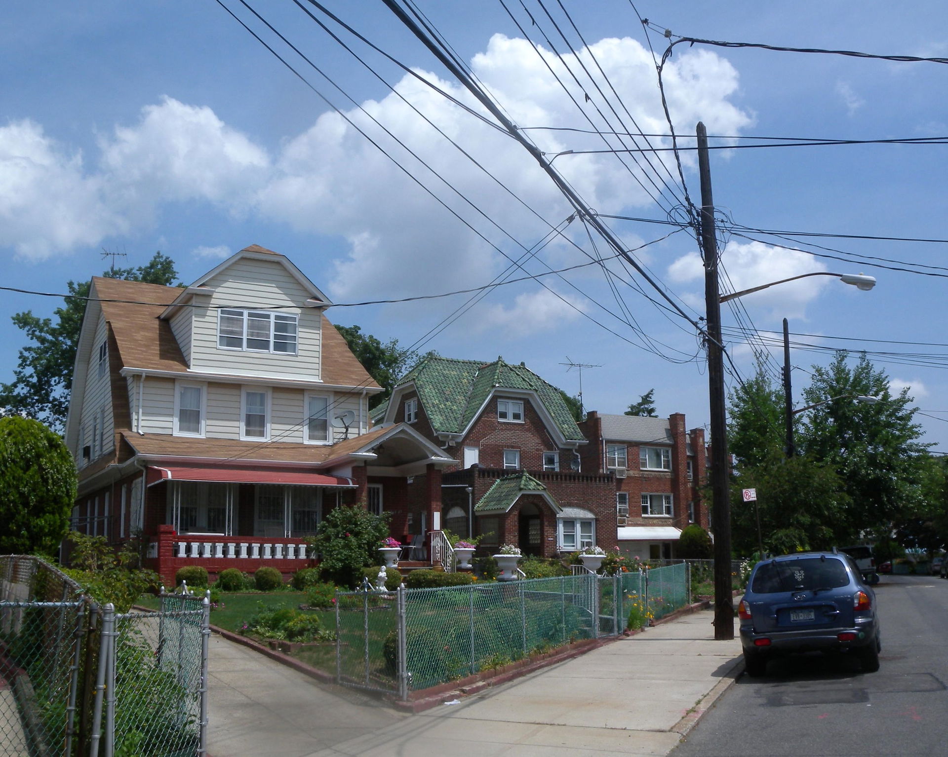 Looking north from 160th Street at houses on Normal Road on a s…