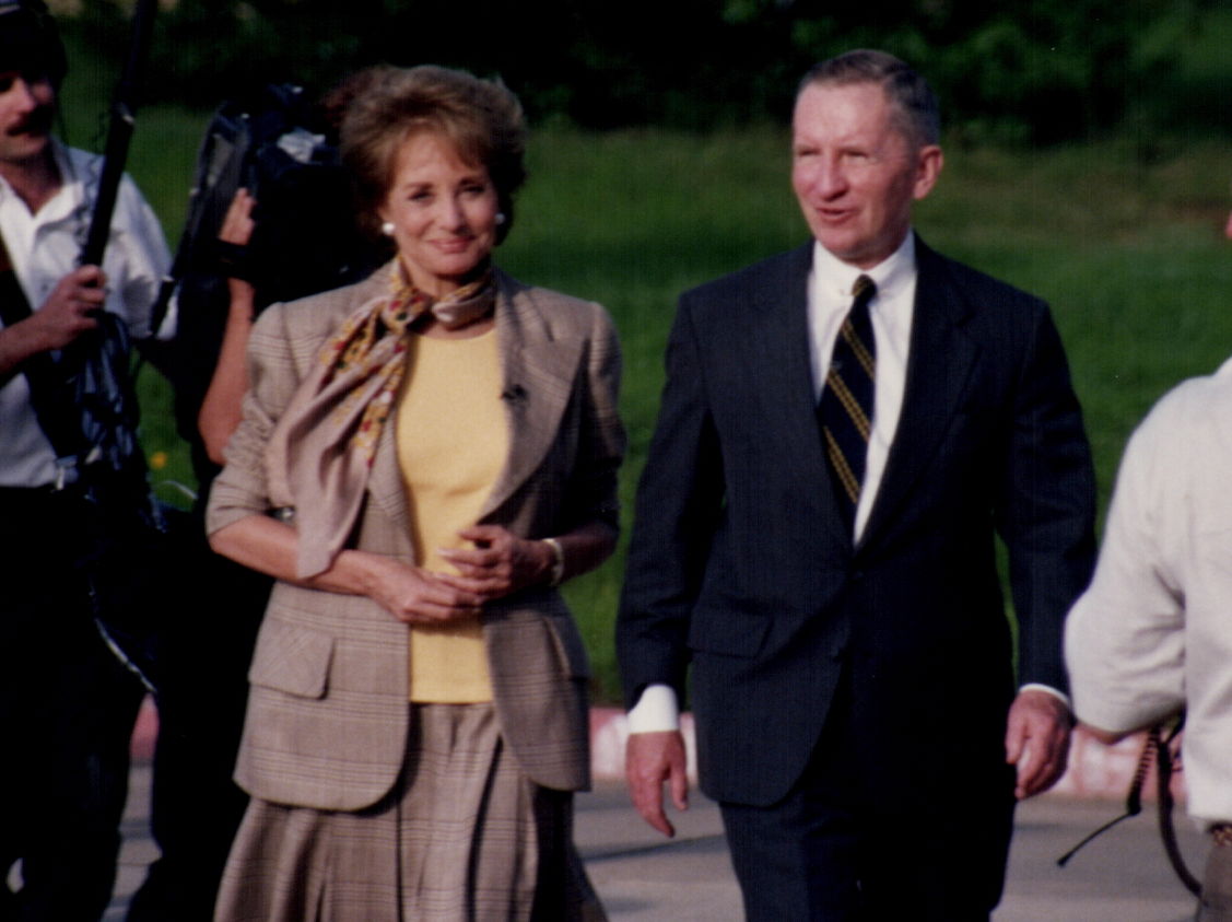 Barbara Walters walks with Ross Perot toward Bryce's Cafeteria …