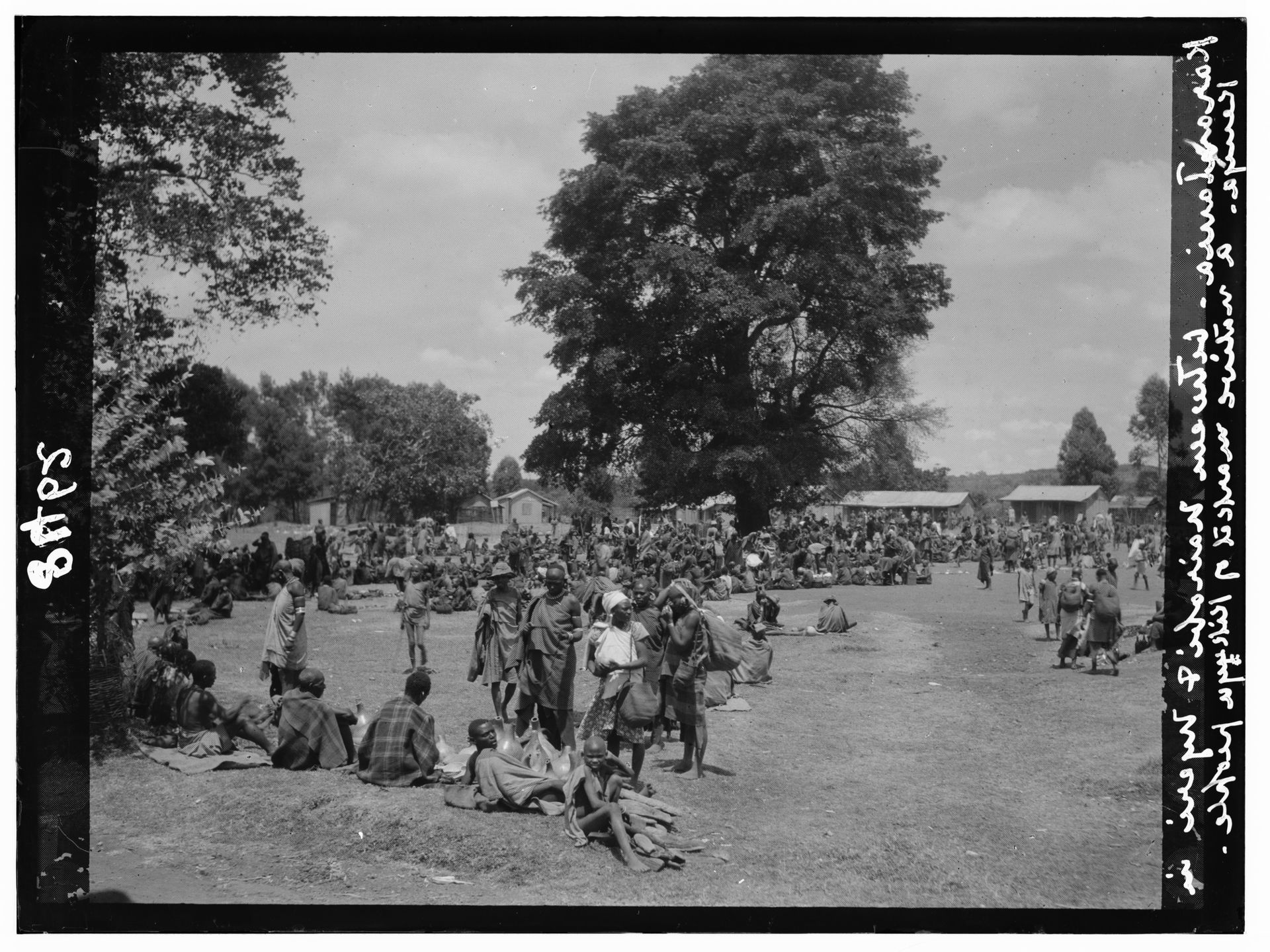 Title: Kenya Colony. Karatina. Native market under large trees
…