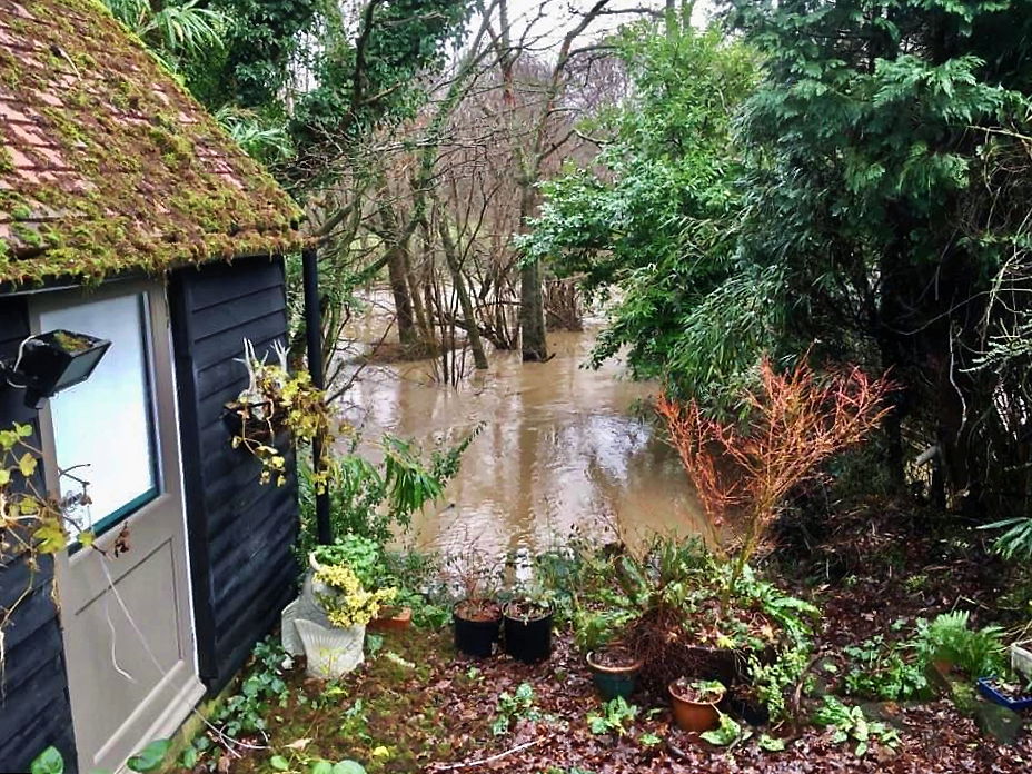 The River Arun in flood looking east at the north of the civil …