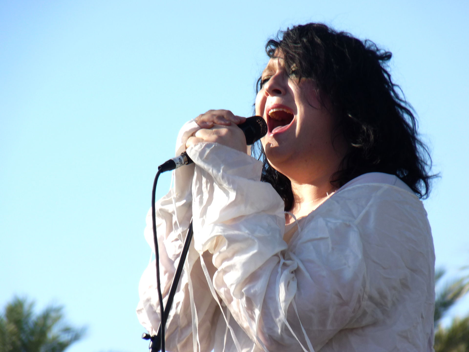 Singing her heart out.
