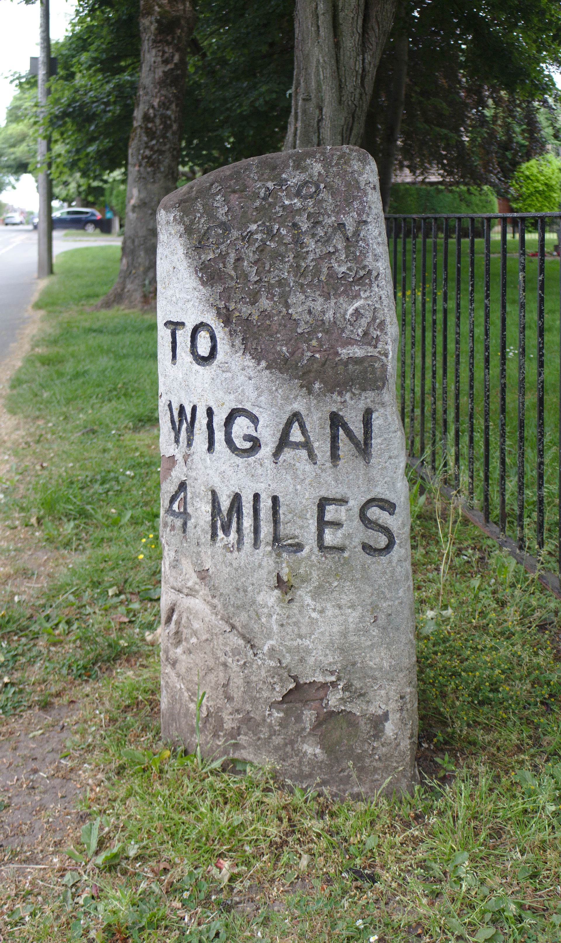 South side, showing 4 miles to Wigan.